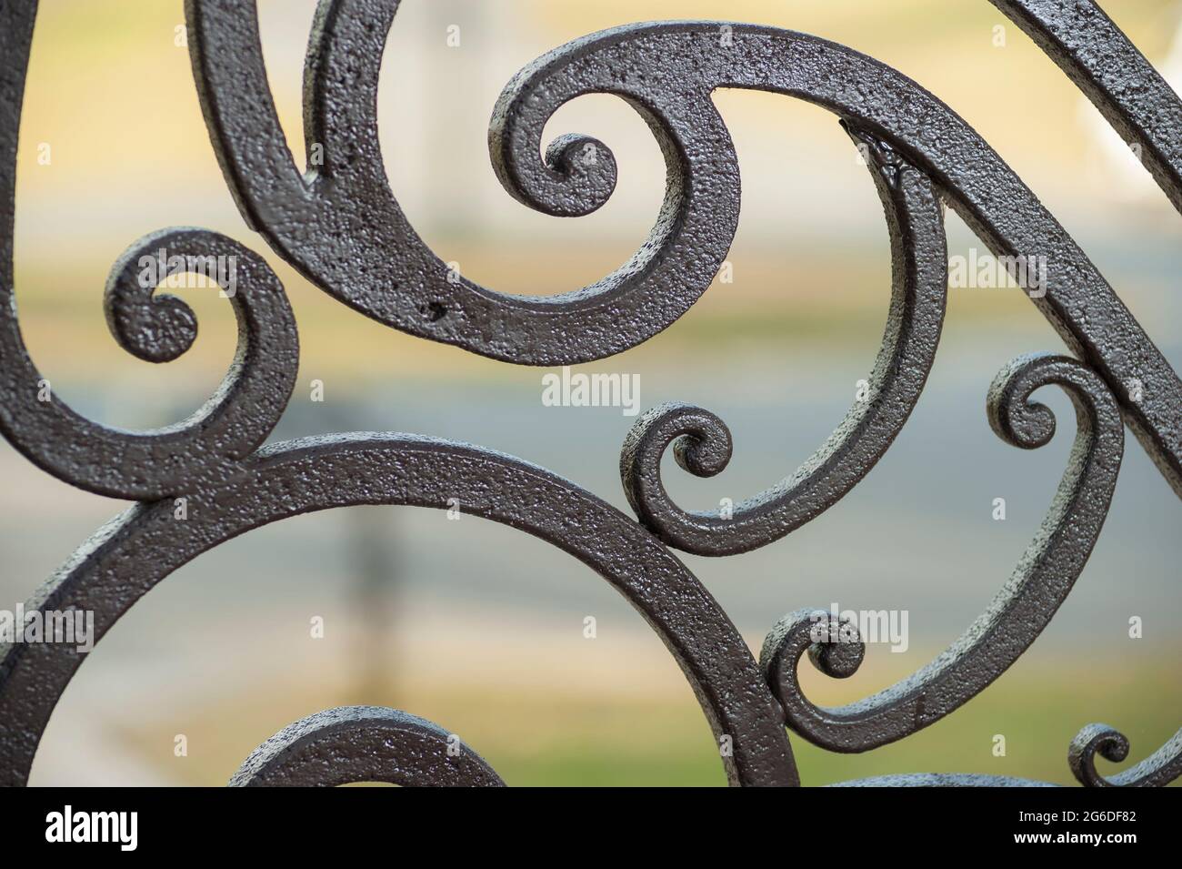 Detail on non forged aluminum decorative metalwork of driveway entry gates. Stock Photo