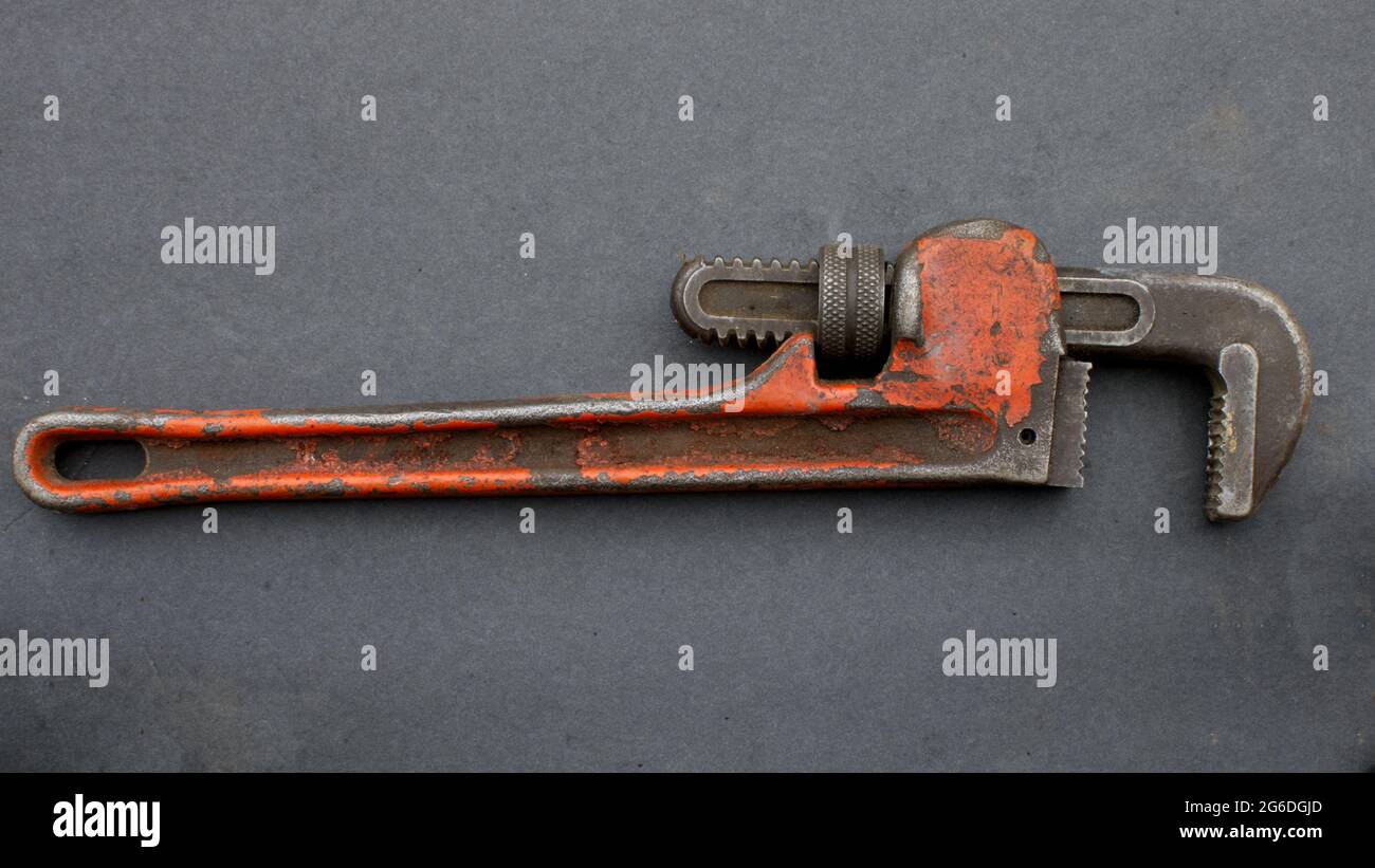 A Pipe Wrench on a Black Background Stock Photo