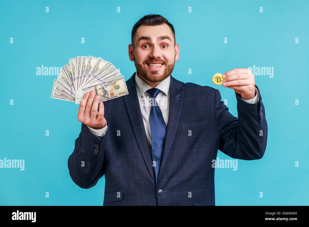 Cryptocurrency btc and money. Portrait of rich happy bearded man elegant  suit showing dollar banknotes and golden bitcoin, smiling to camera. Indoor  s Stock Photo - Alamy