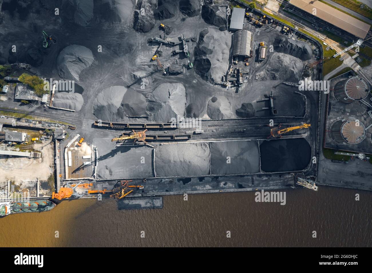Loading and unloading coal on ship terminal sea cargo port, industrial ...