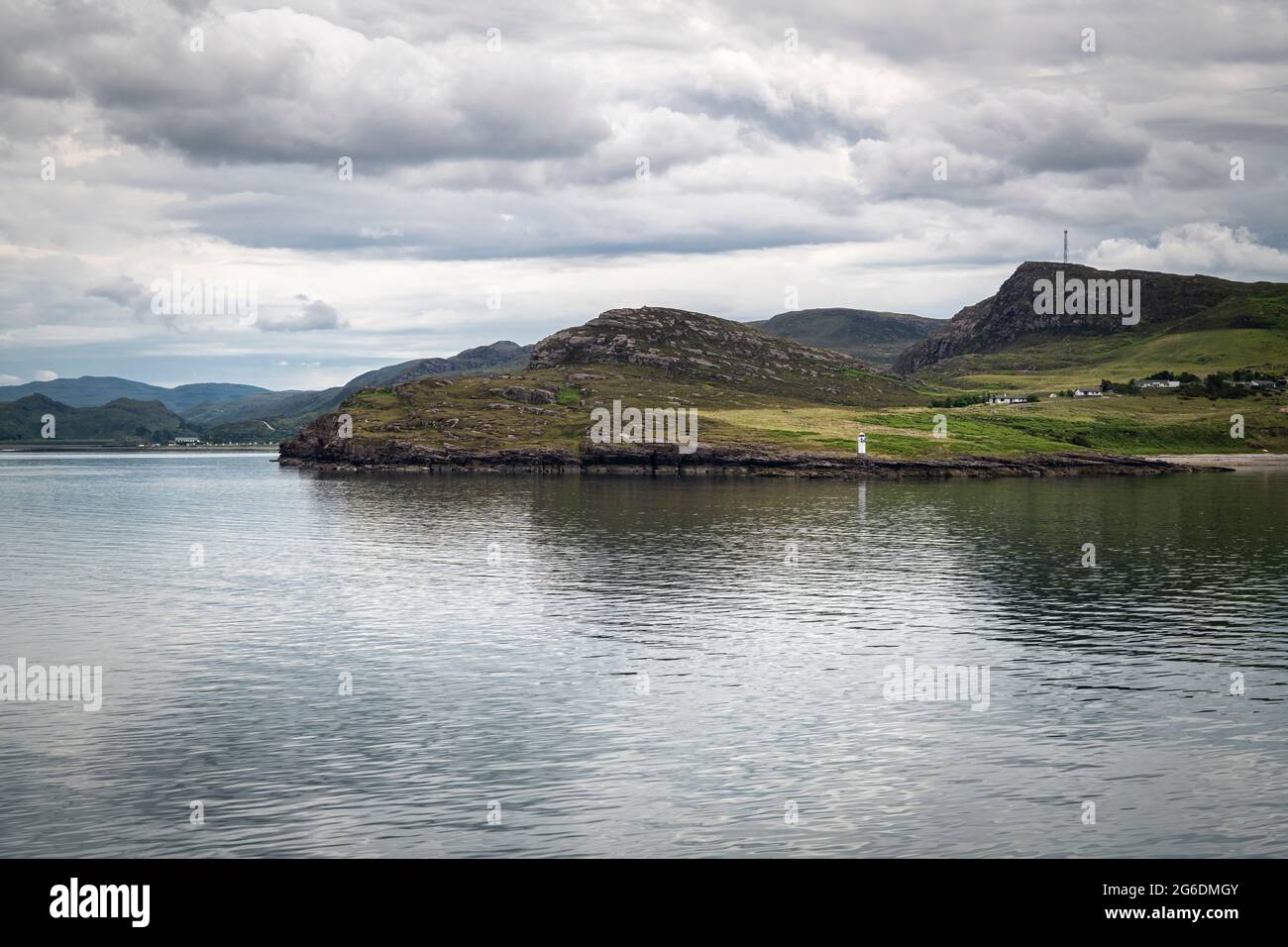 A 3 shot HDR image of Rudhacadail, the Point of the Sleepy People, and it's lighthouse leaving Ullapool bound for Stornoway, Scotland. 19 June 2021 Stock Photo