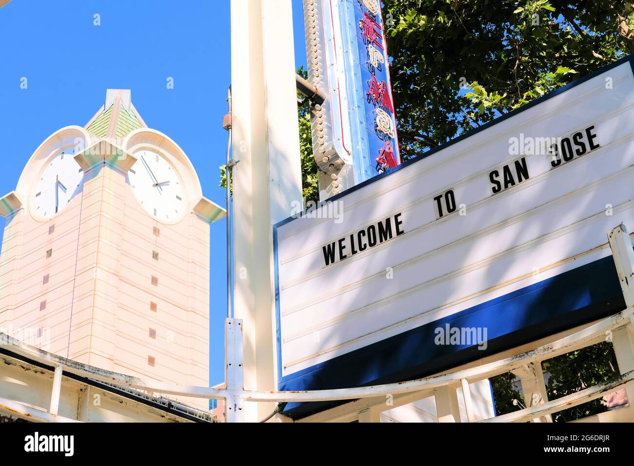 Welcome to San Jose in block letters on the vacant Camera 12 Cinema building in downtown San Jose, California with the Pavilion Shopping Center clock. Stock Photo