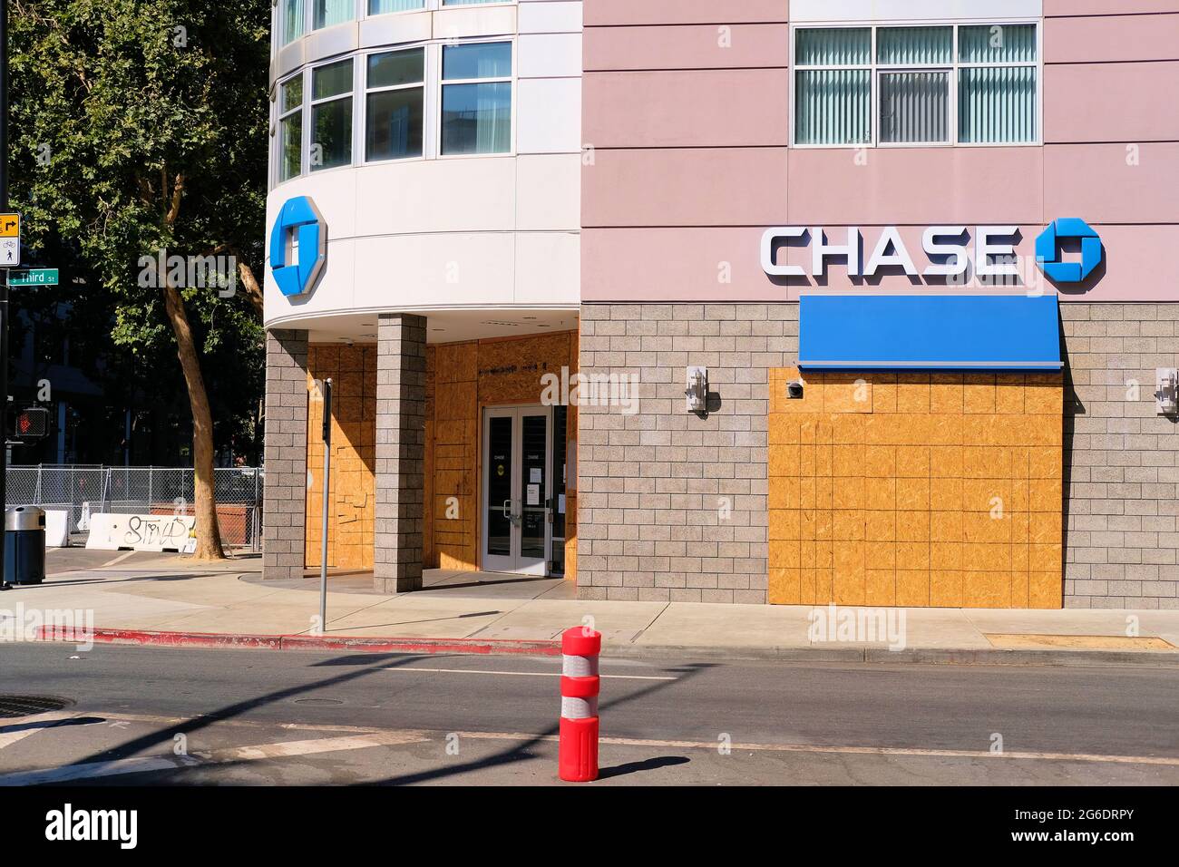 Exterior view of a boarded up and temporarily closed Chase bank in downtown San Jose, California; fear of protesters, looting, and social unrest. Stock Photo