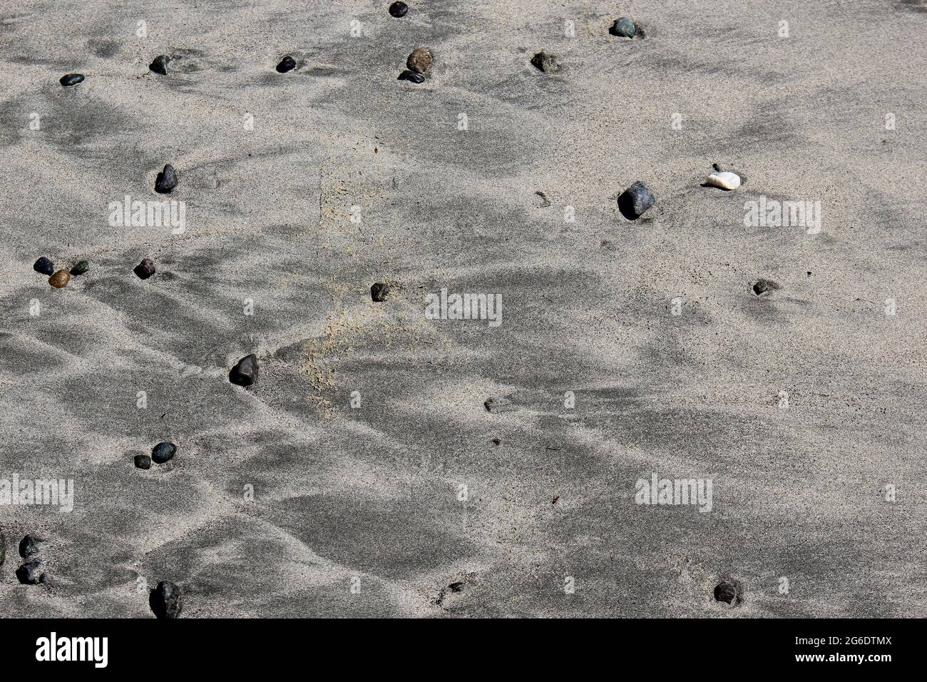 Beach pebbles in sand on west coast vancouver island Stock Photo