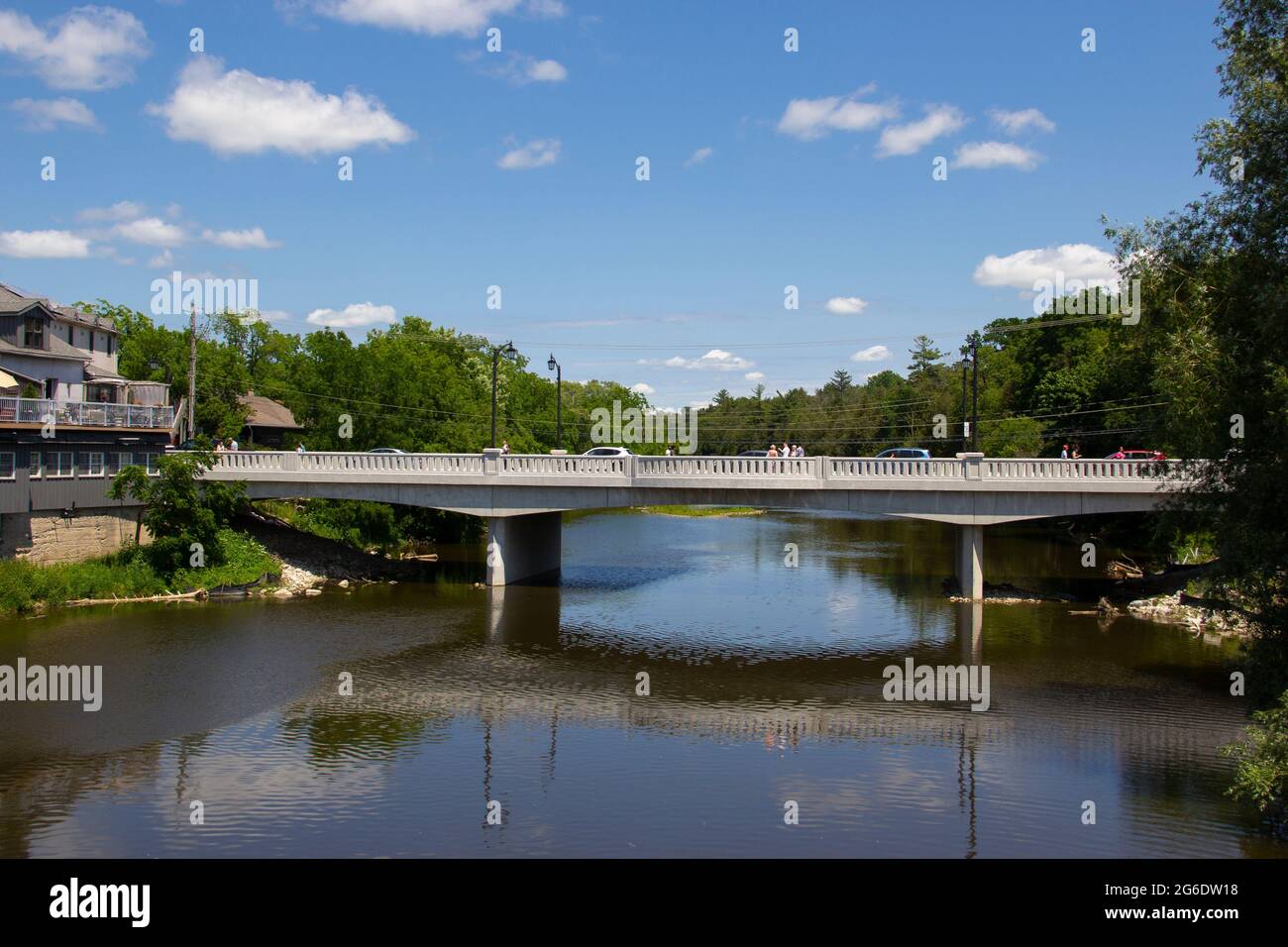 Bridge Over A Still River Stock Photo - Alamy