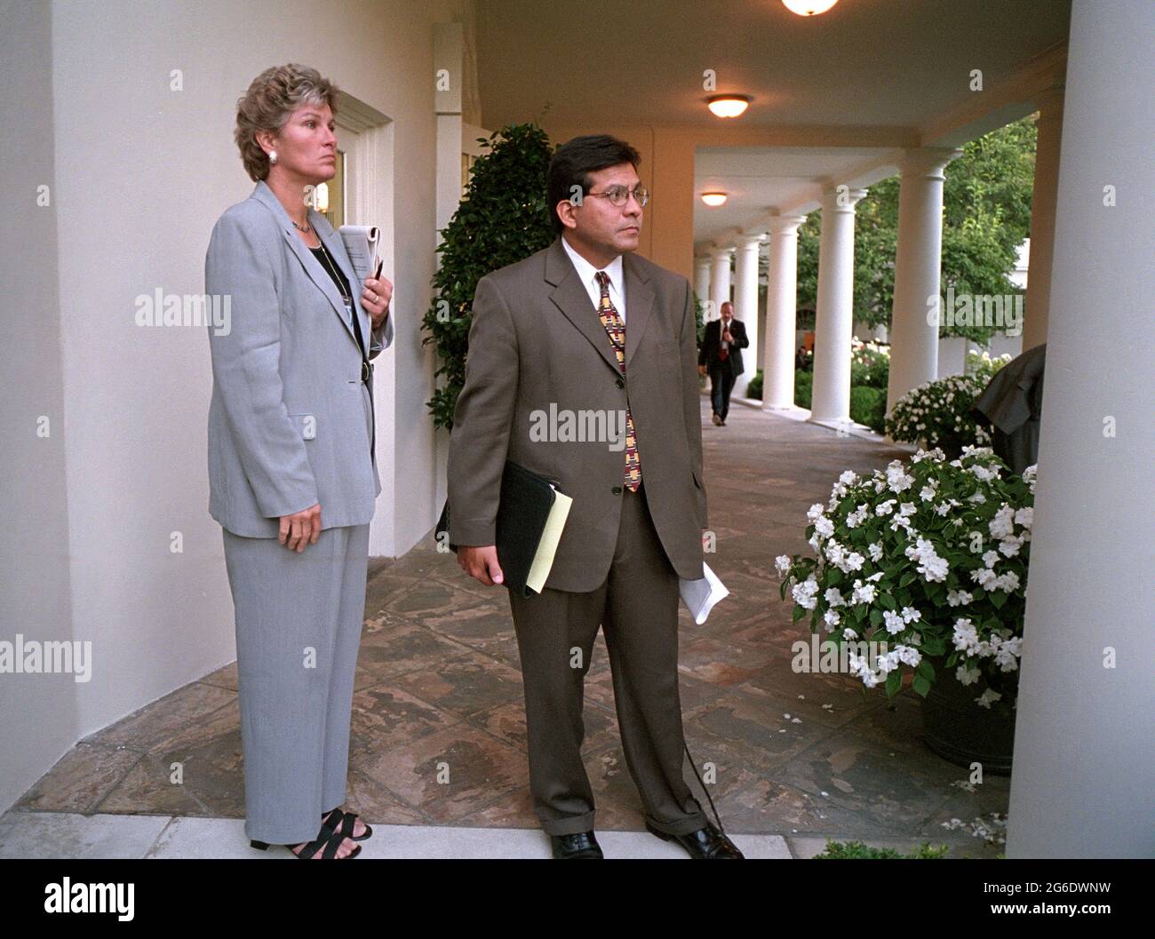Counselor Karen Hughes and Counsel Alberto Gonzales wait on the Colonnade for President George W. Bush to arrive at the White House Tuesday, Sept. 11, 2001.  Photo by Paul Morse, Courtesy of the George W. Bush Presidential Library Stock Photo