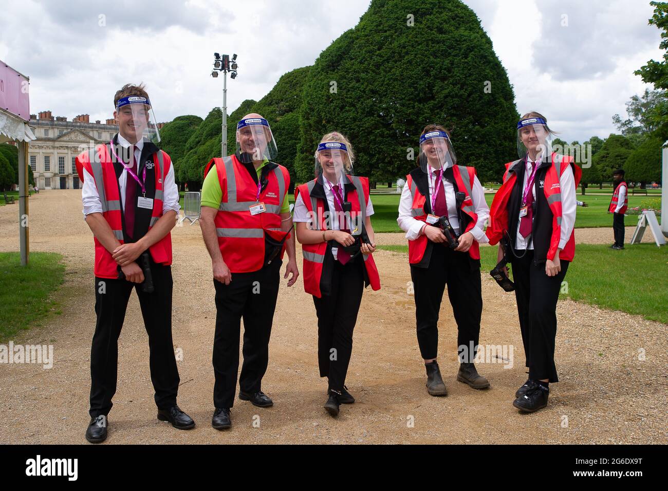 East Molesey, Surrey, UK. 5th July, 2021. Workers at the RHS Hampton Court Palace Garden Festival wearing face sheilds due to the Covid-19 lockdown. Boris Johnson has announced today that from 19th July 2021, it will no longer be mandatory to wear face masks or face coverings in most situations. Credit: Maureen McLean/Alamy Live News Stock Photo