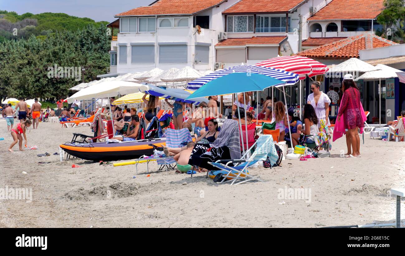 Cesme, Izmir, Turkey. 05th July, 2021. Daily life in summer season during Covid-19 outbreak in Boyalik Beach of Cesme, in Izmir, Turkey on July 05, 2021. The country welcomes back domestic and international tourists with the decrease of coronavirus cases. Turkey has ended pandemic curfews and lockdowns on 1 July as the part of normalization. Credit: İdil Toffolo/Alamy Live News Stock Photo