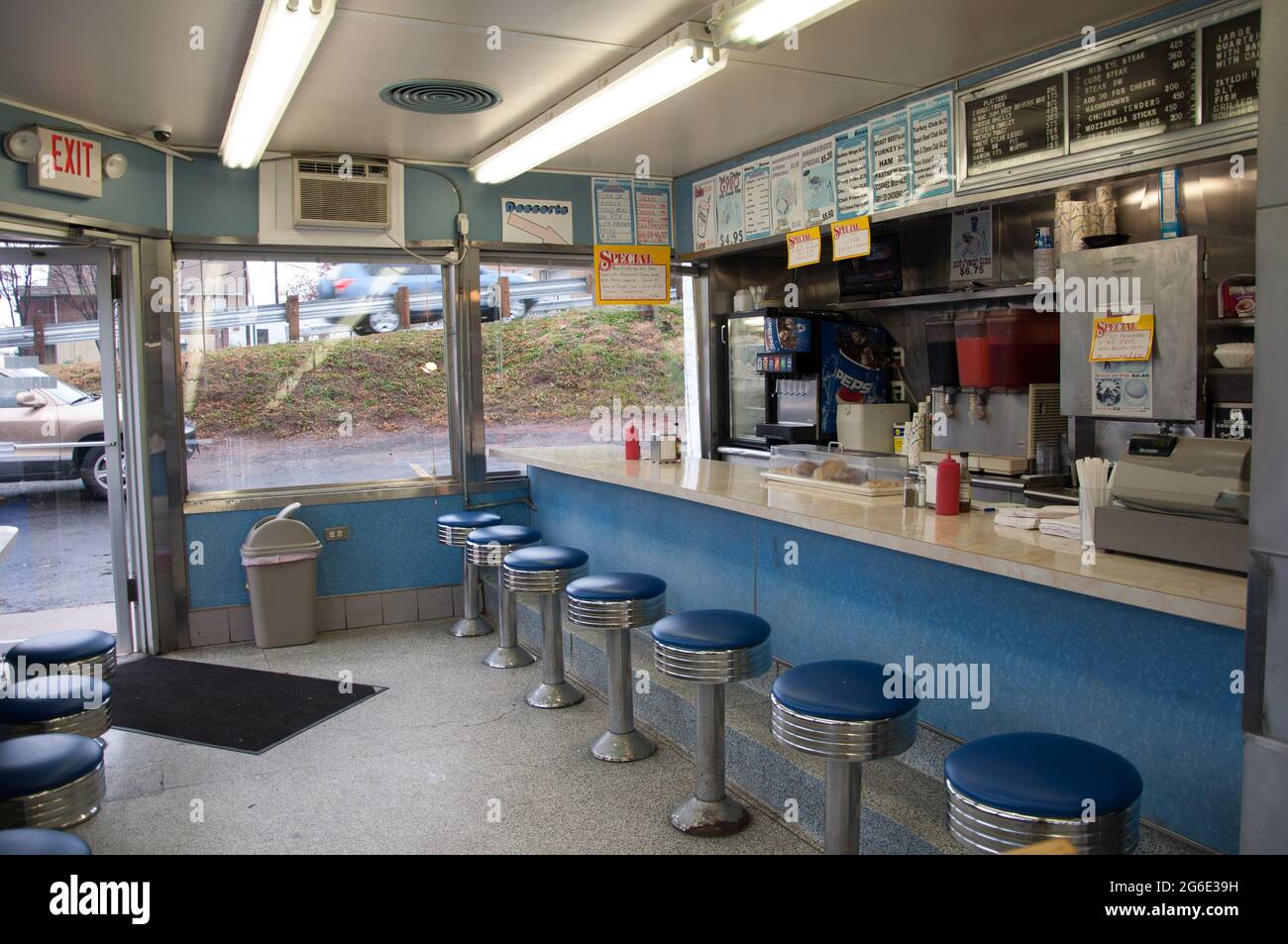 Original 1950's diner with chrome and blue vinyl stools and a long counter in New Jersey. Stock Photo