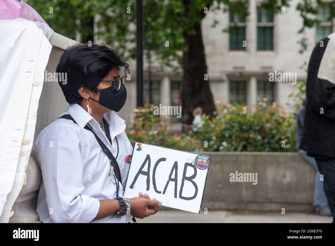 (EDITORS' NOTE : Image contains profanity)  A protesters holds a sign with ‘ACAB’ (All coppers are bastards) during the protest. Protesters gather at Parliament Square in protest against the Police, Crime, Sentencing and Courts Bill. The Bill will allow the police to take a more proactive approach in managing highly disruptive protests causing serious disruption to the public and widen the range of conditions that the police can impose on assemblies (static protests). (Photo by Dave Rushen / SOPA Images/Sipa USA) Stock Photo