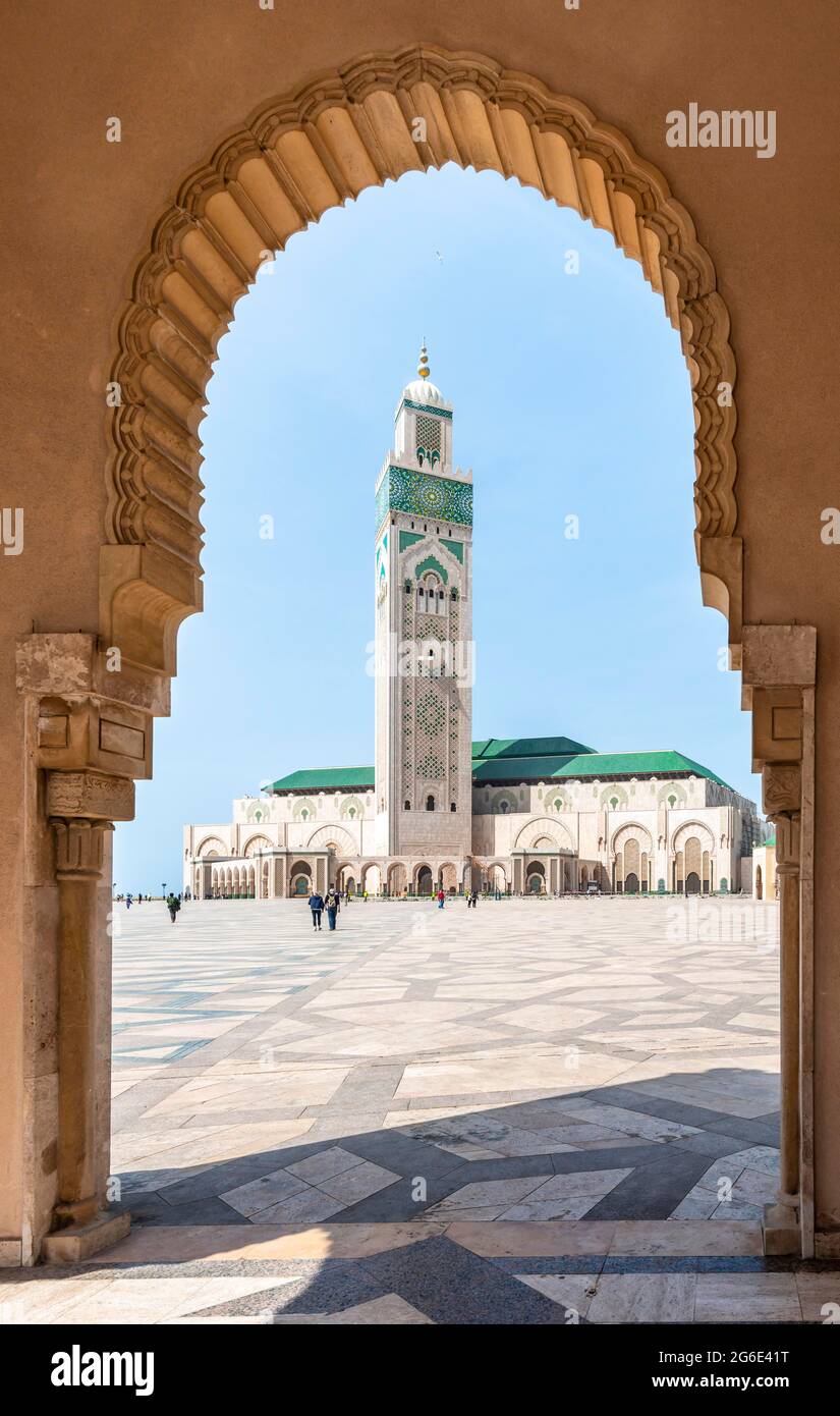 View through archway to Hassan II Mosque, Grande Mosquee Hassan II, Moorish architecture, with 210m highest minaret in the world, Casablanca, Morocco Stock Photo
