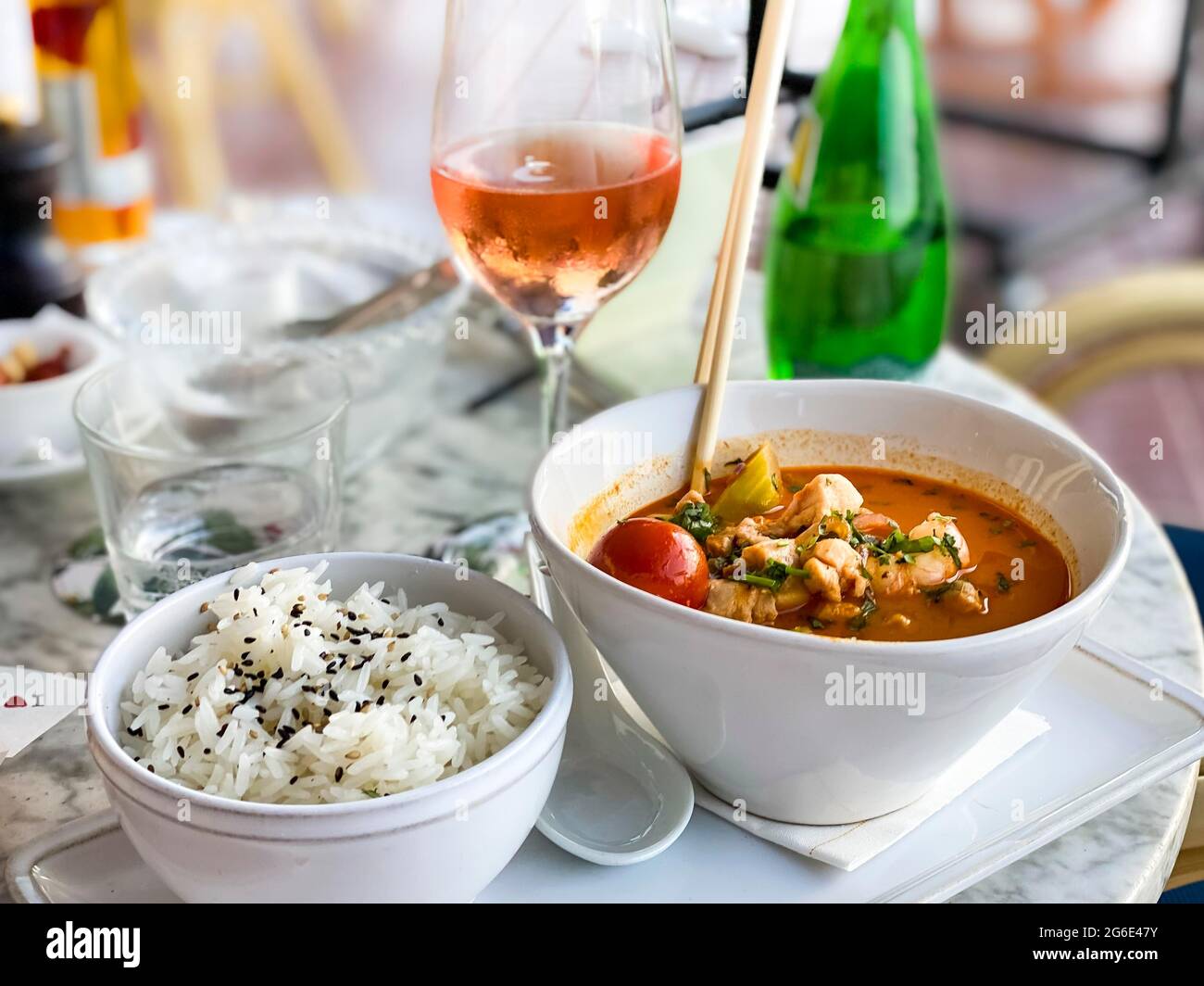 Asian soup in coconut sauce with shrimp and fish with rice, Port Andratx, Majorca, Spain Stock Photo