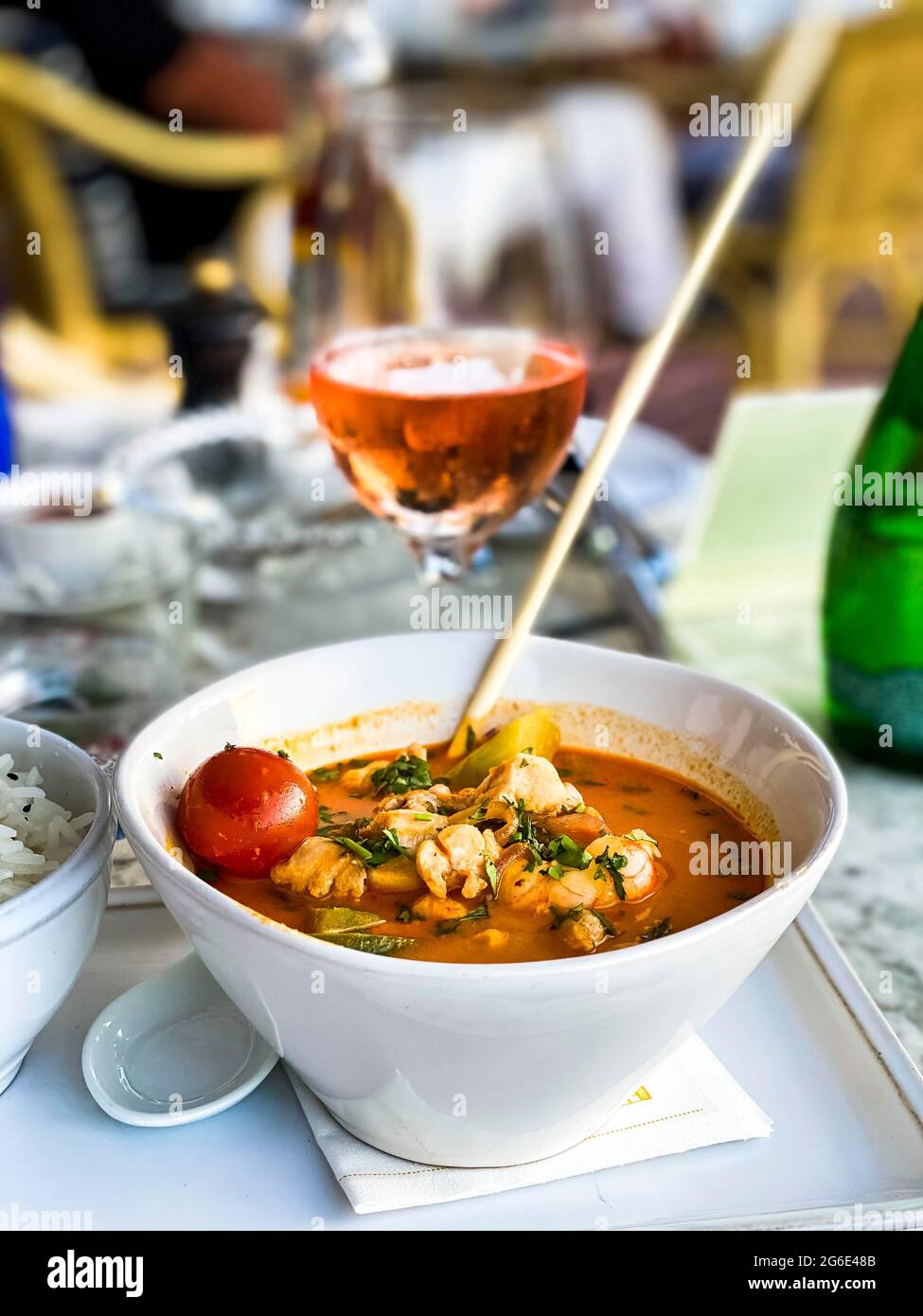 Asian soup in coconut sauce with shrimp and fish with rice, Port Andratx, Majorca, Spain Stock Photo