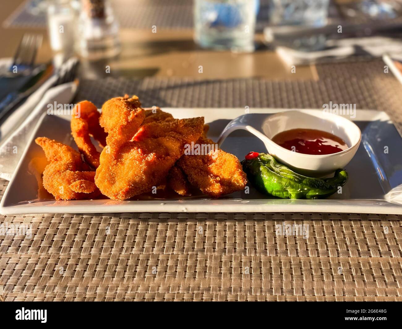Fried chicken wings with sweet and sour sauce, Port Andratx, Majorca, Spain Stock Photo