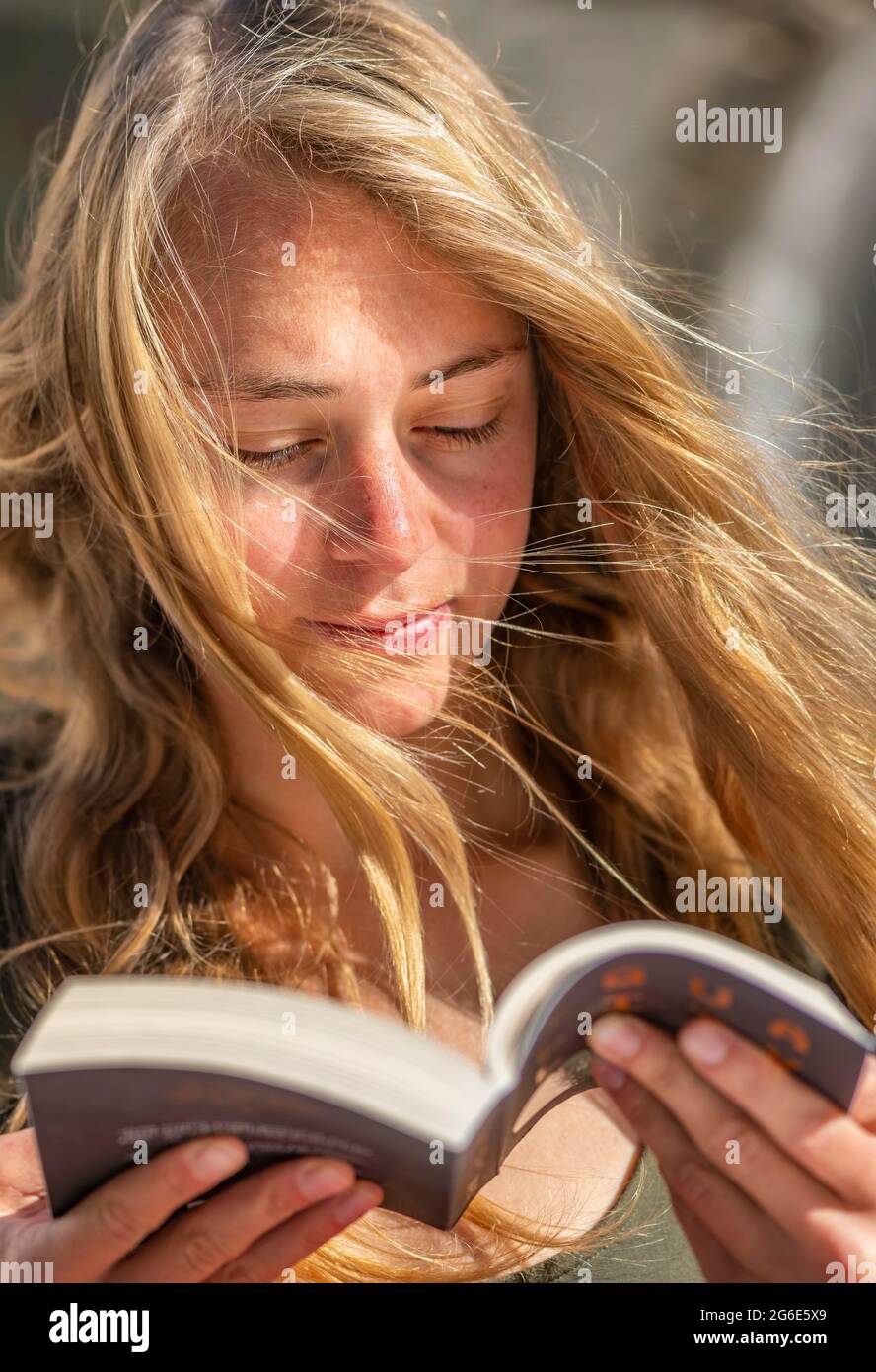 Young woman reading, Greece Stock Photo