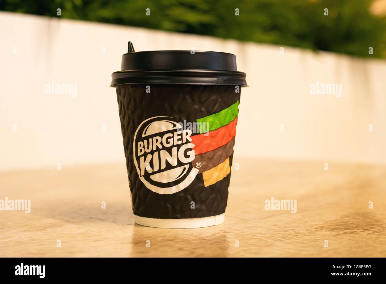 BELARUS, NOVOPOLOTSK - 02 JULE, 2021: Paper cup of coffee with Burger King logo on table Stock Photo