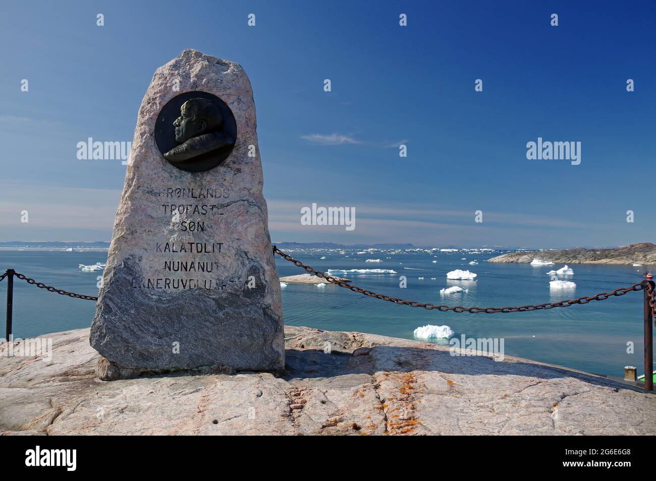 Monument to Knud Rasmussen, stone, bay with icebergs, Ilulissat, Disko Bay, Greenland, Denmark Stock Photo