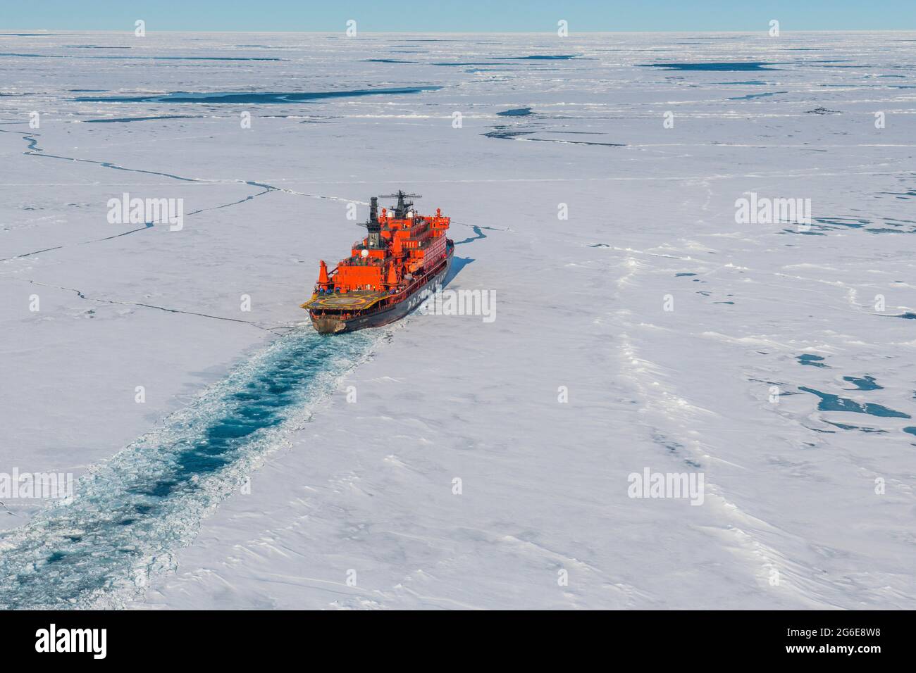 Aerial of the Icebreaker '50 years of victory' on its way to the North Pole breaking through the ice, Arctic Stock Photo