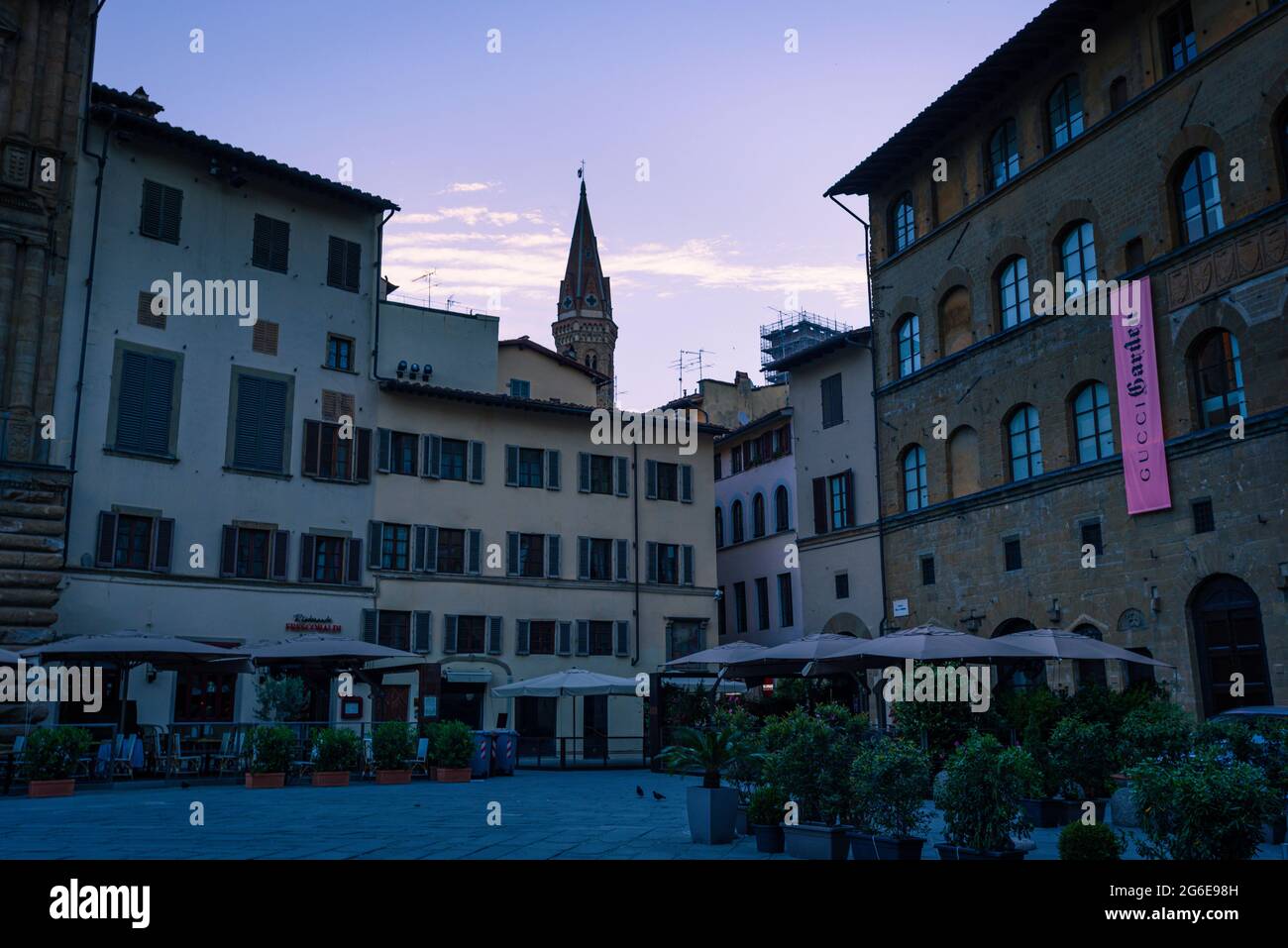 Piazza della signoria in Florence. Empty during blue hour at down. With empty restaurants, gucci garden and bell tower in the historical centre o Stock Photo