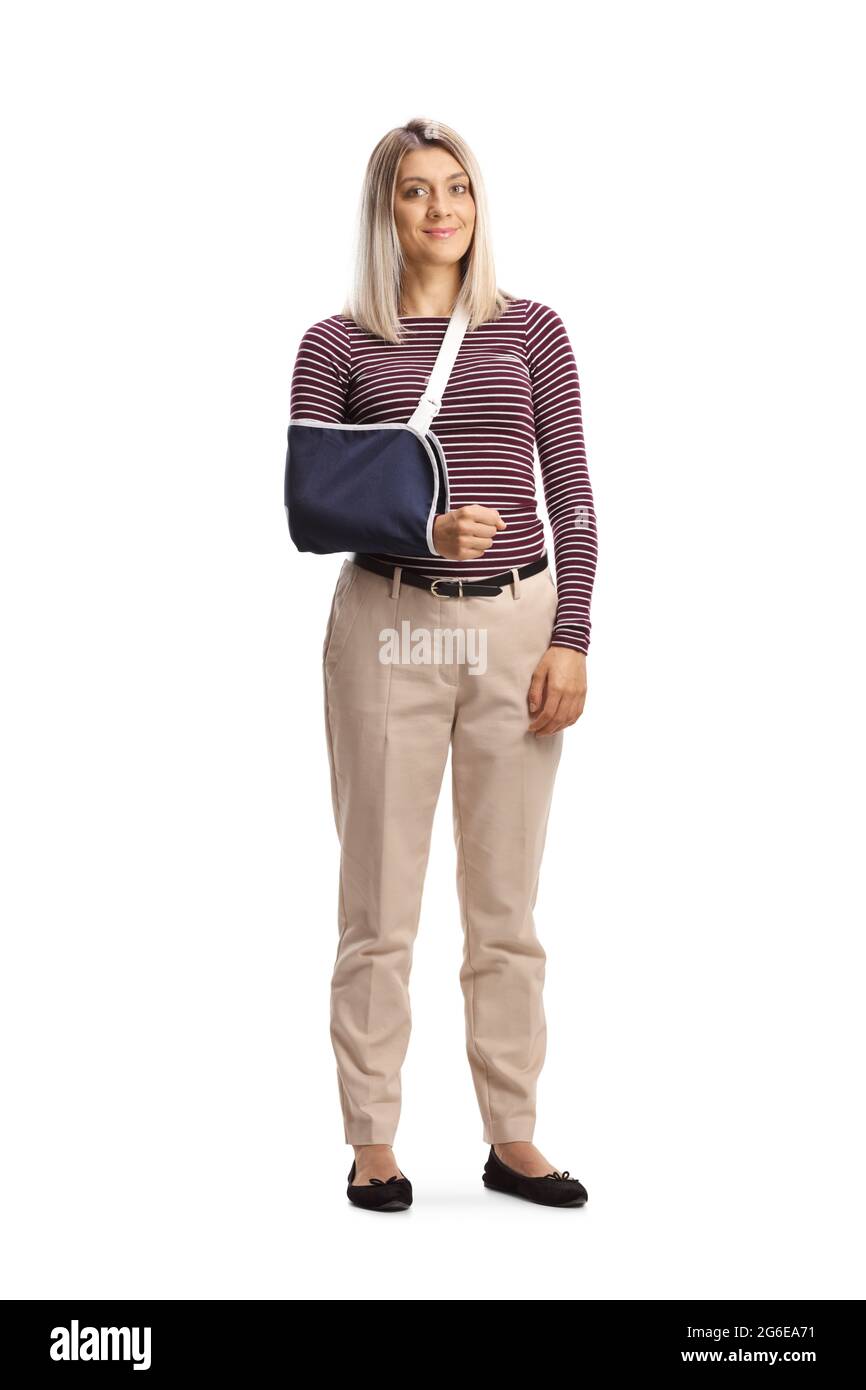 Full length portrait of a young woman with a broken arm wearing an arm