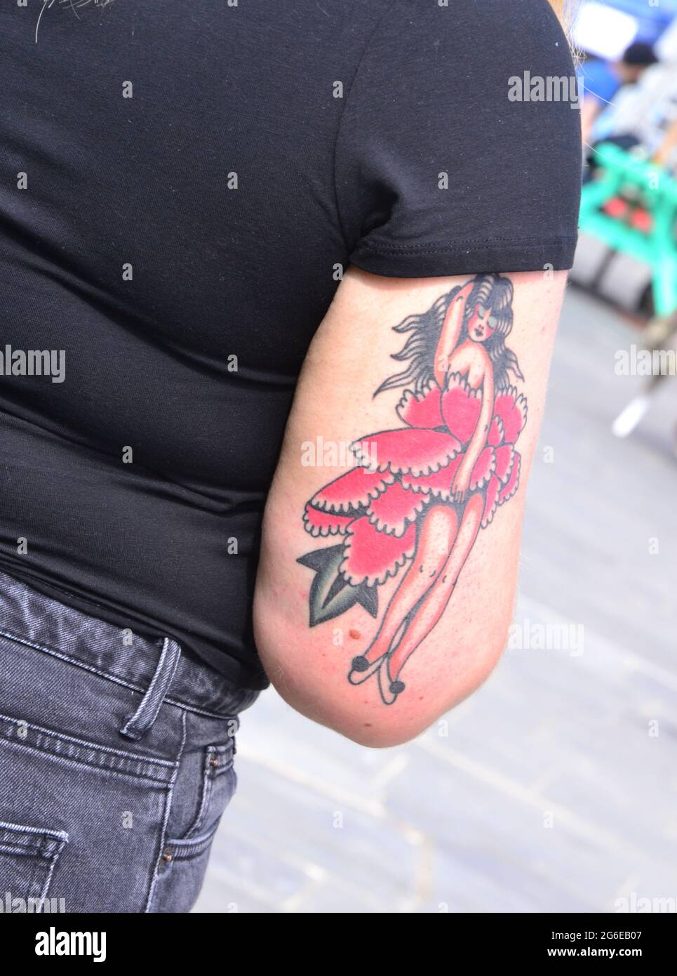 Tattoo of a woman on the arm of a woman  in Manchester, England, United Kingdom Stock Photo