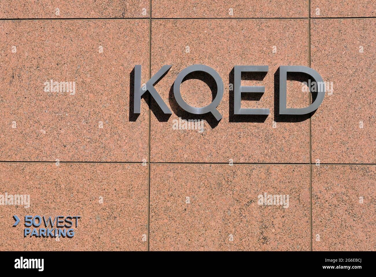 Radio and television station letters on a wall at the entrance to the KQED building at 50 West San Fernando Street, in downtown San Jose, California. Stock Photo