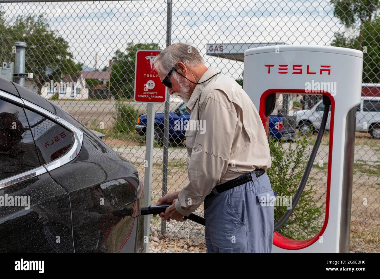 Poncha Springs, Colorado A traveler plugs in his Tesla at a Tesla