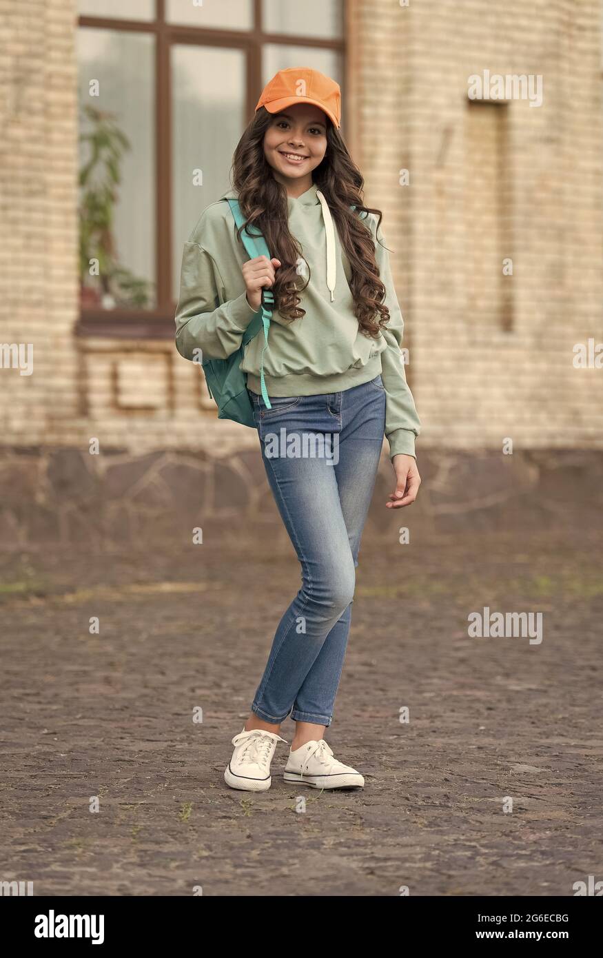 Fashionable little girl smile with fashion look wearing trendy clothes on  urban outdoors, casual Stock Photo - Alamy