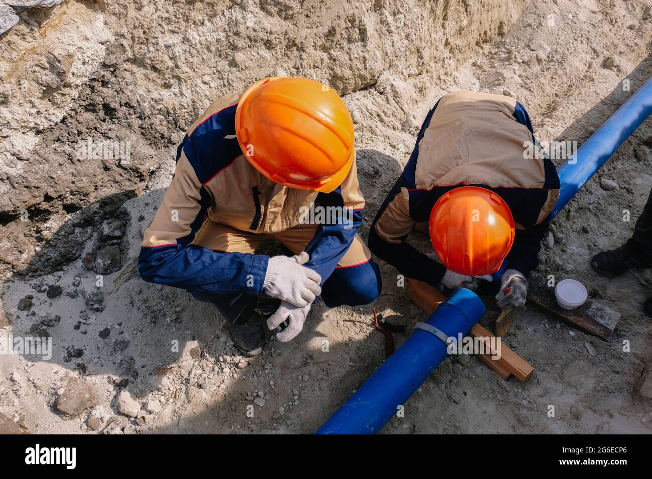 Workers are installing water supply pipeline system. Stock Photo