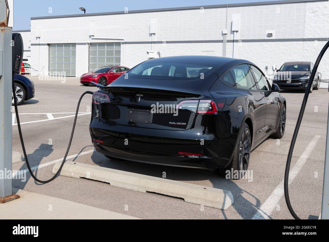 Indianapolis - Circa July 2021: Tesla electric vehicles awaiting preparation for sale. Tesla products include electric cars, battery energy storage an Stock Photo