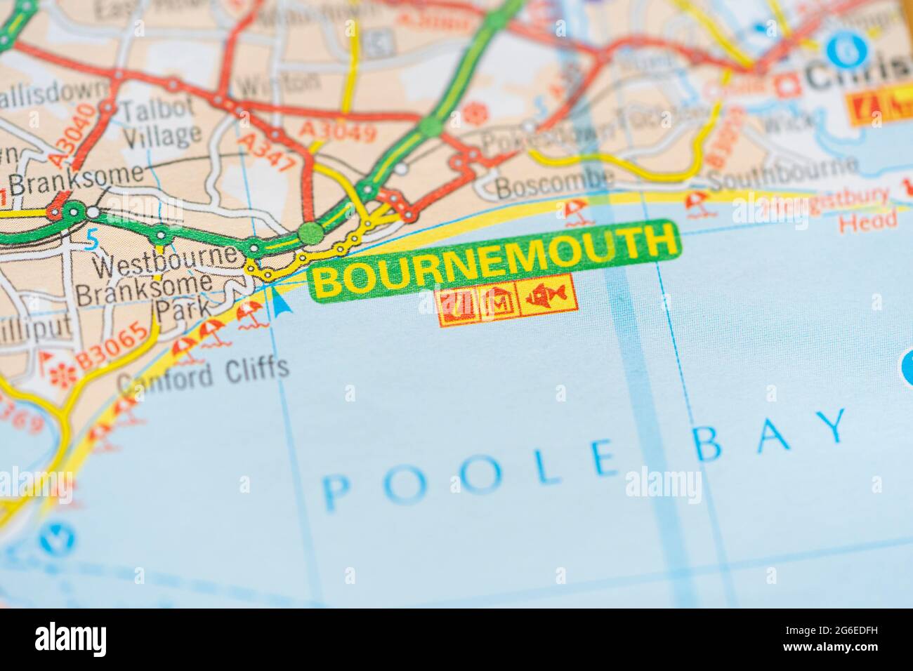 A macro closeup of a page in a printed road map atlas showing the coastal resort town of Bournemouth in England Stock Photo
