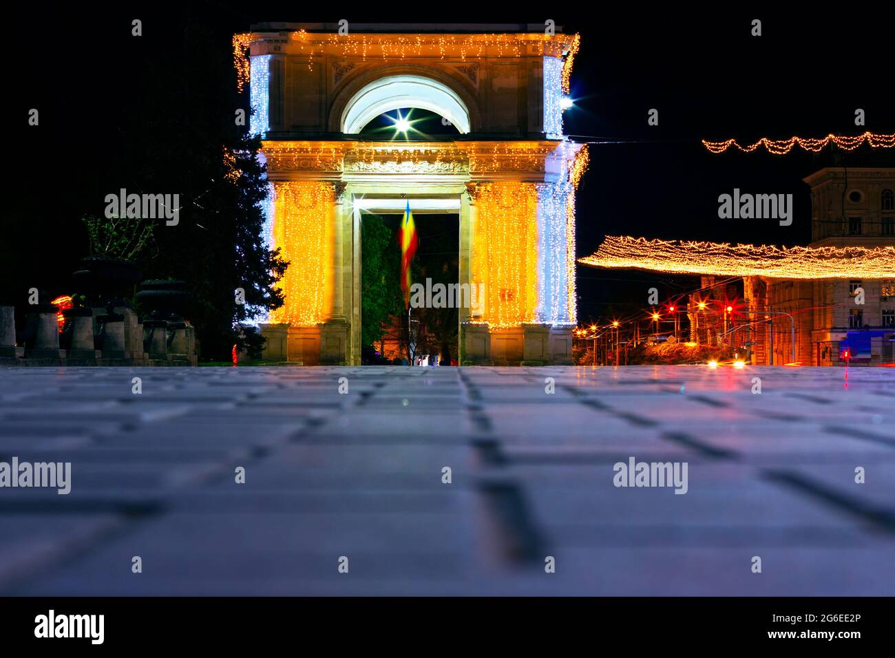 New Year Night in Chisinau Moldova . Christmas street decorations in European Capital City . Triumphal arch with garlands in Chisinau Stock Photo