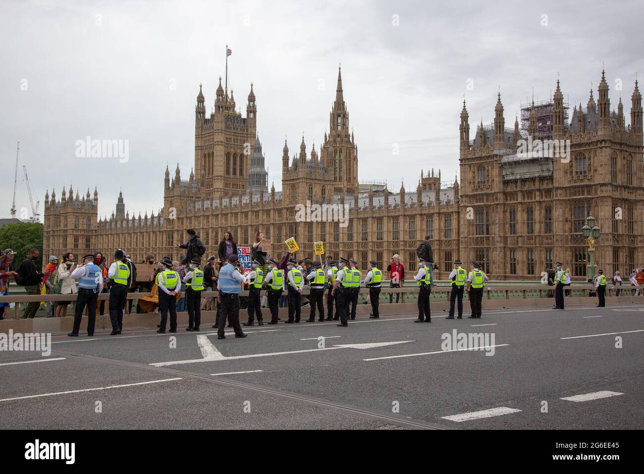 Protesters amidst police on Westminster Bridge as part of a 'Kill the Bill' protest in Central London, 5,7,2021 Stock Photo