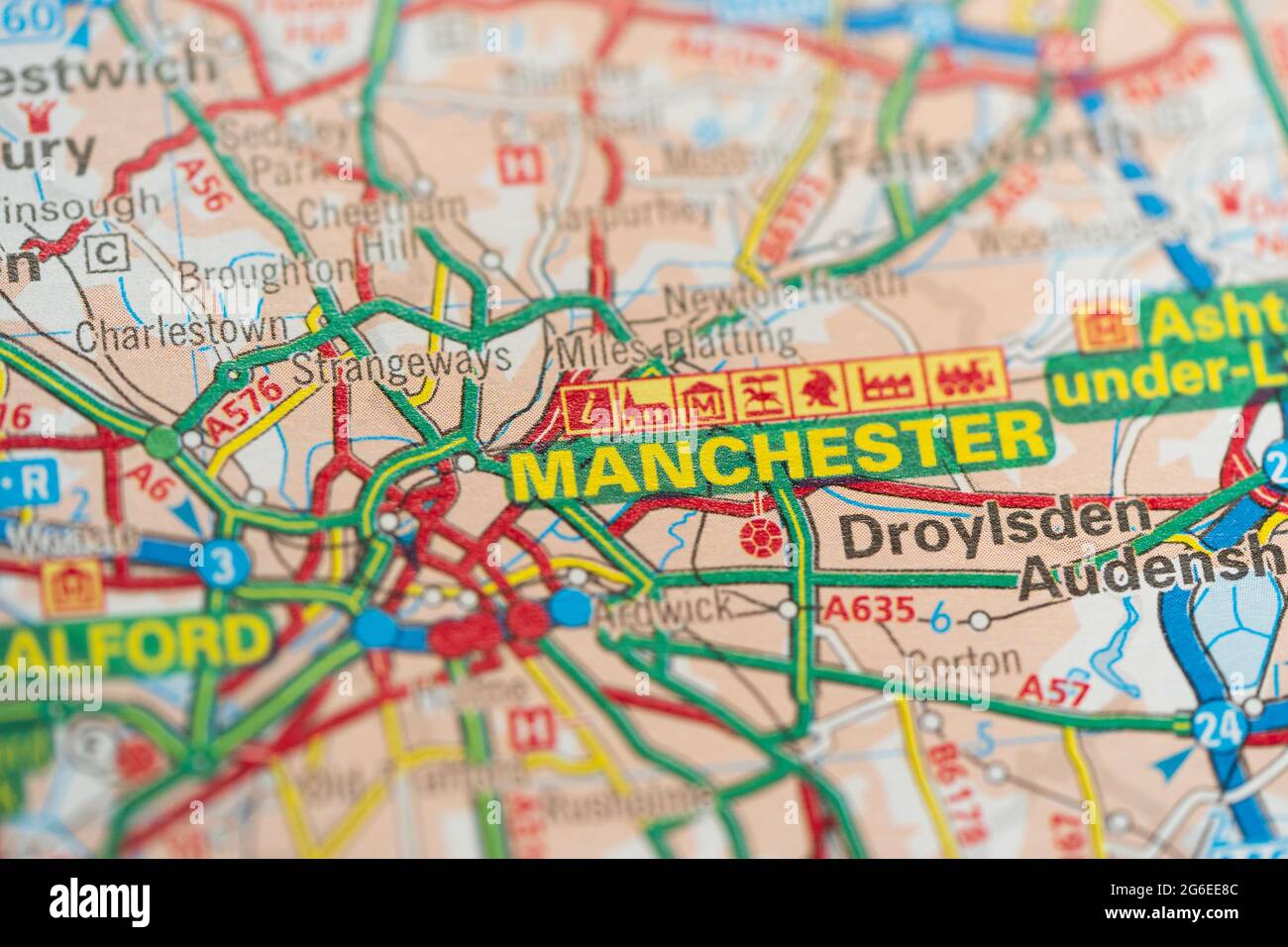 A macro closeup of a page in a printed road map atlas showing the city of Manchester, England Stock Photo