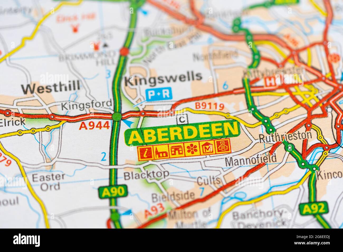 A macro closeup of a page in a printed road map atlas showing the Scottish city of Aberdeen