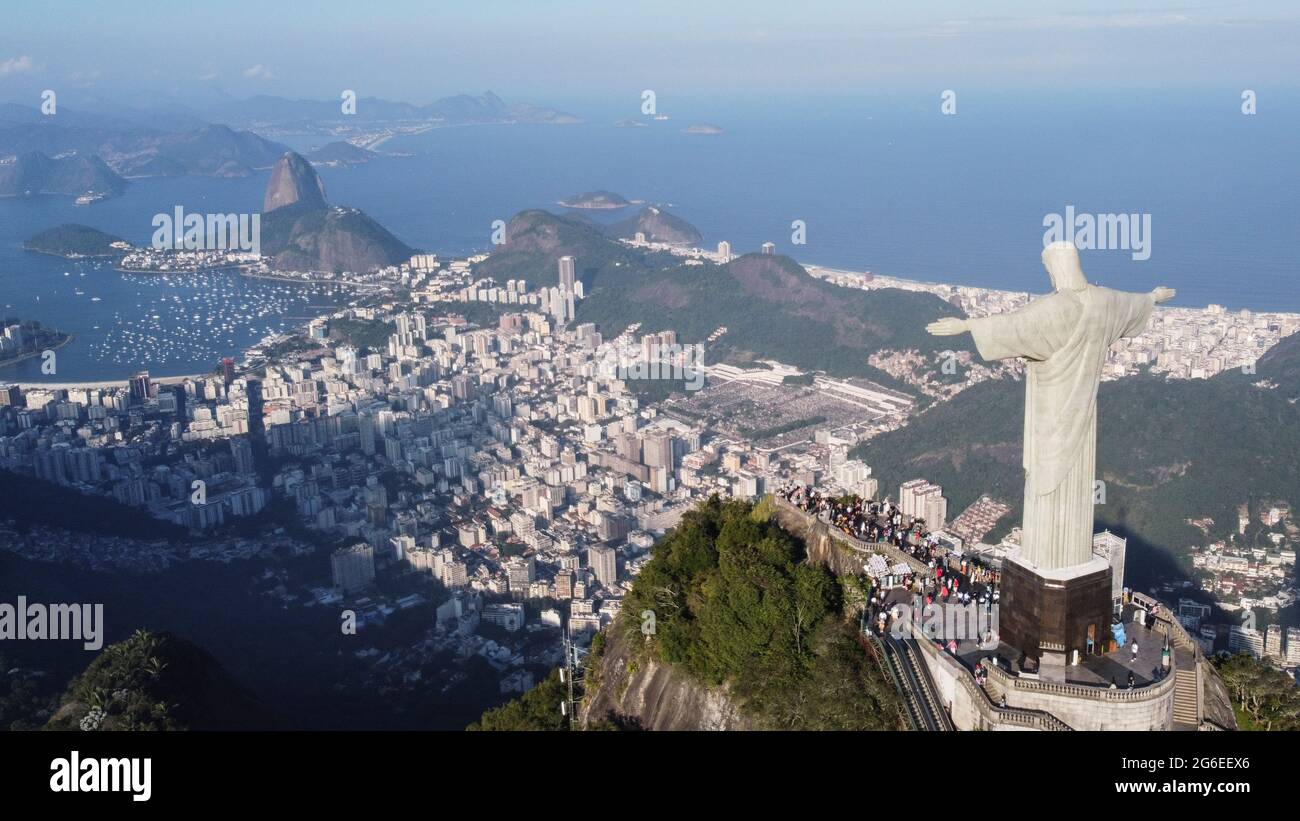 Aerial view of the Christ the Redeemer statue at Corcovado Mountain  - with Sugarloaf and Rio de Janeiro at its feet, Rio de Janeiro aerial view Stock Photo