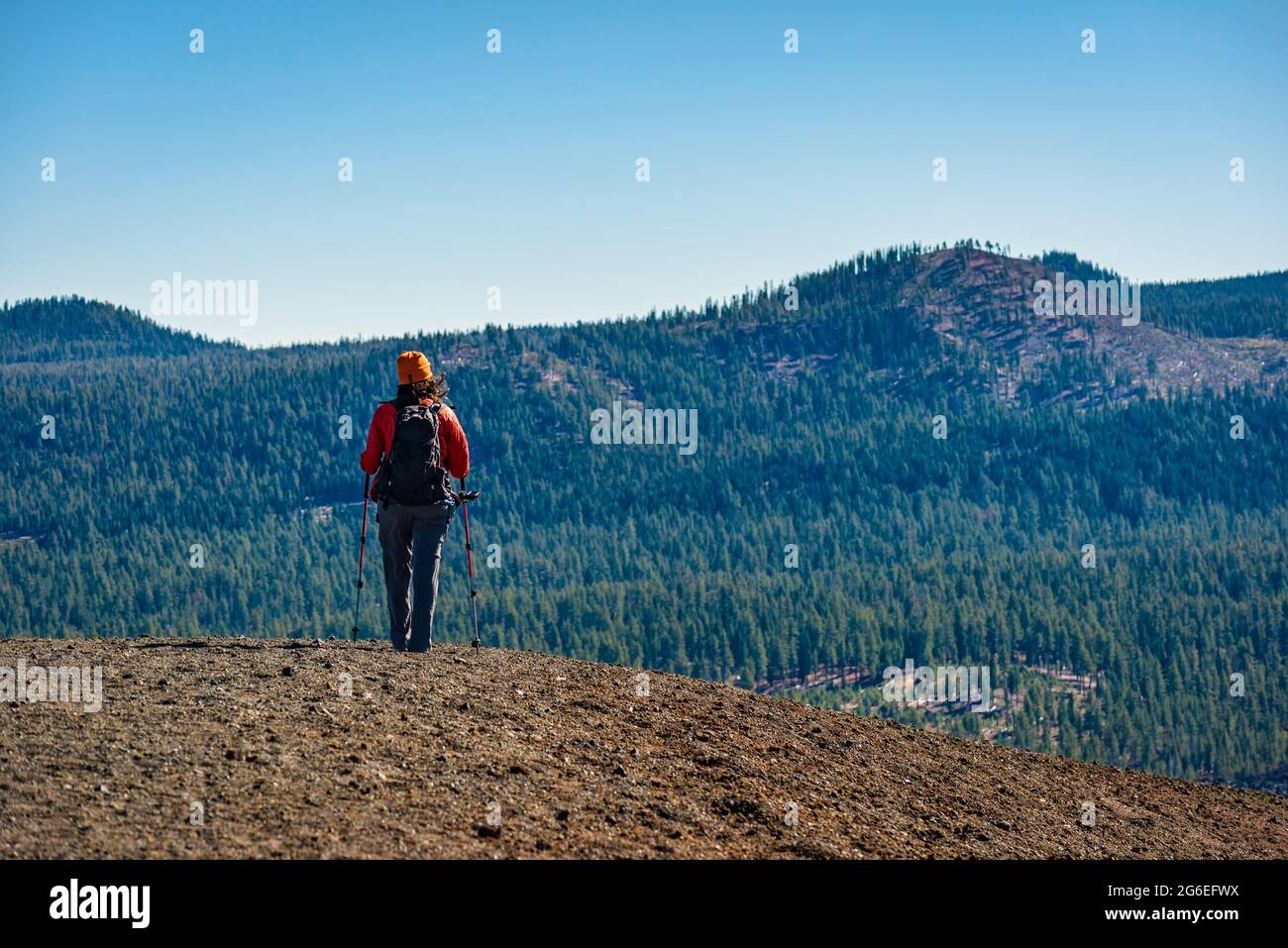 A day hiker on top of the Cinder Cone at Lassen Volcanic National Park Stock Photo