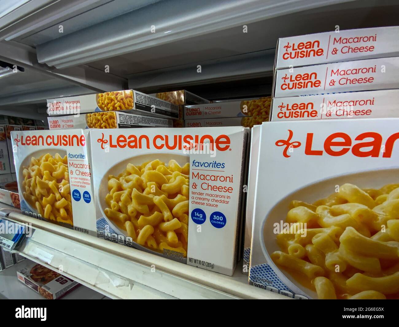 Saint Louis, MO—July 2, 2021; rows of boxes with frozen meals in grocery store freezer section with orange and white lean cuisine brand marking. Stock Photo