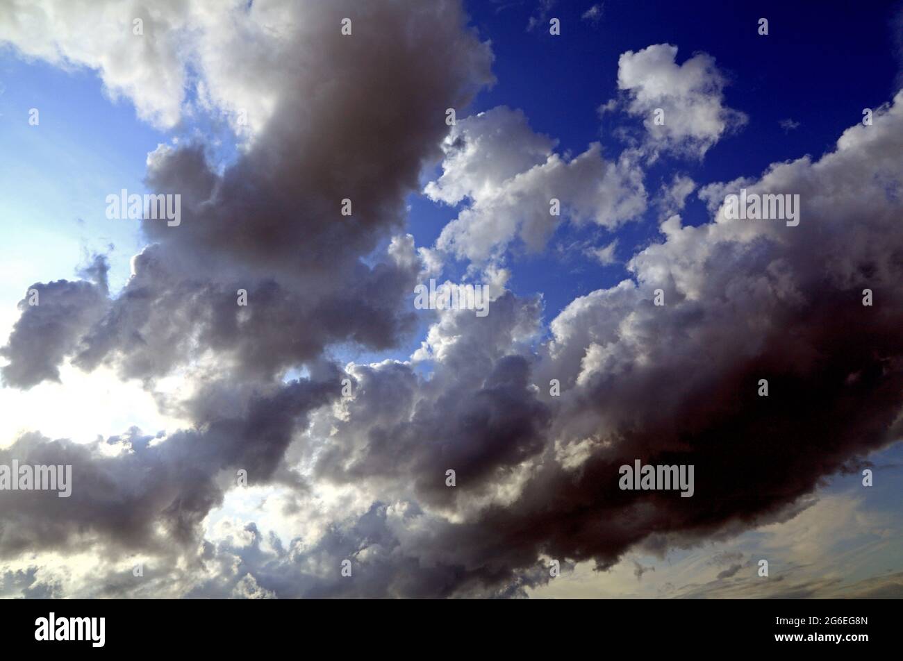 Cloudy sky, white, grey, black, cloud, clouds, blue skies, meteorology, weather, threatening Stock Photo