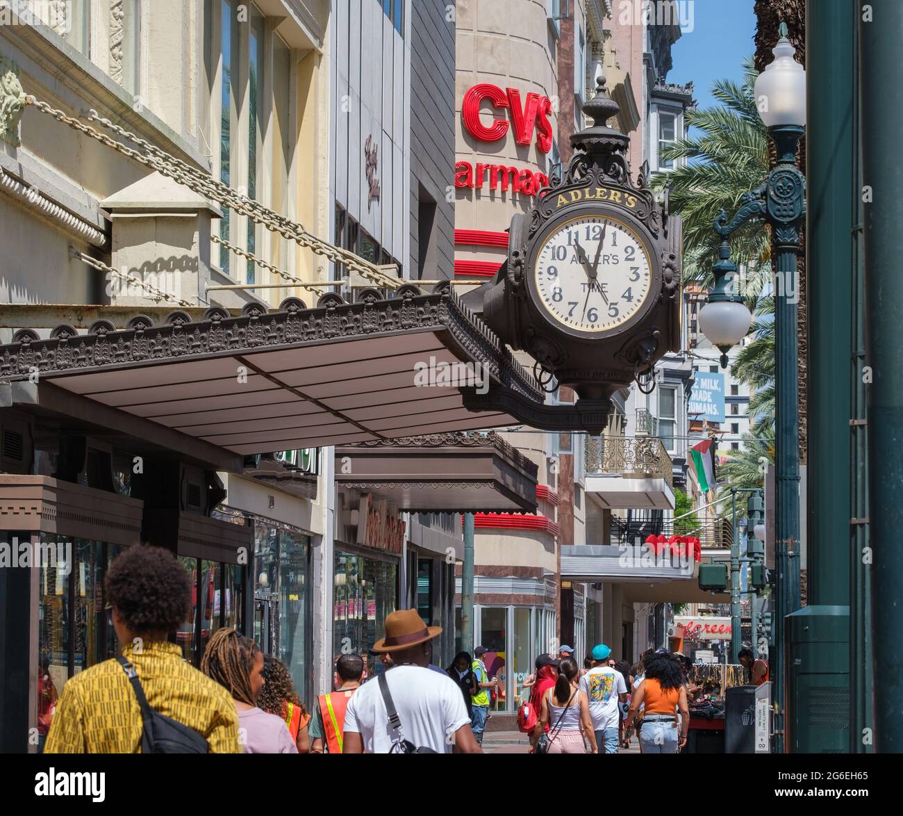 NEW ORLEANS, LA, USA MAY 22, 2021 Adler's clock, shops and crowd on