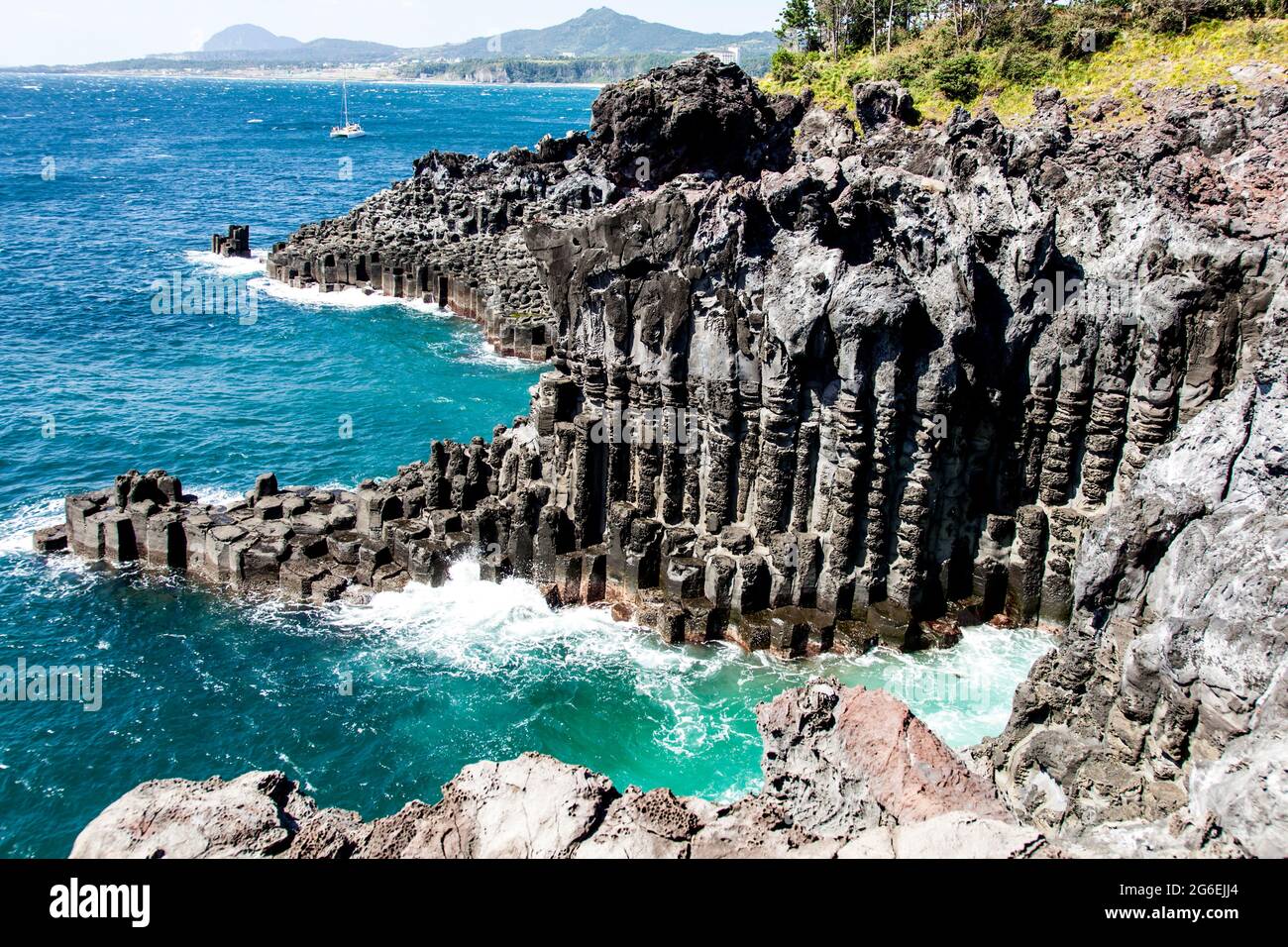 The most famous natural wonder the Columnar Joint rock formation on Jeju Island in South Korea Stock Photo