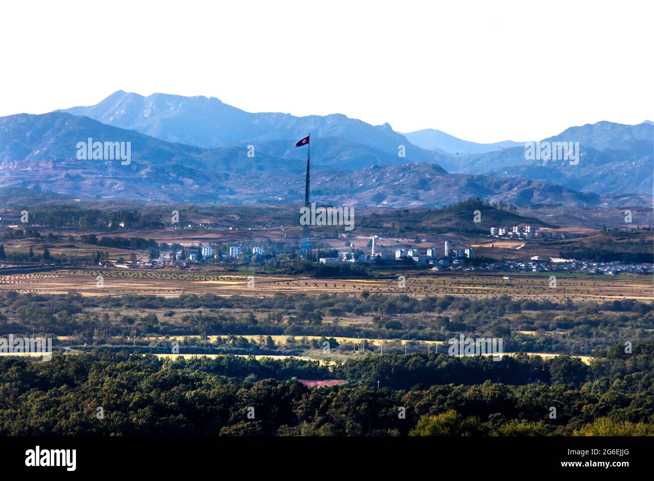 Looking at North Korean propaganda village across the DMZ from  Injingak Park in South Korea Stock Photo