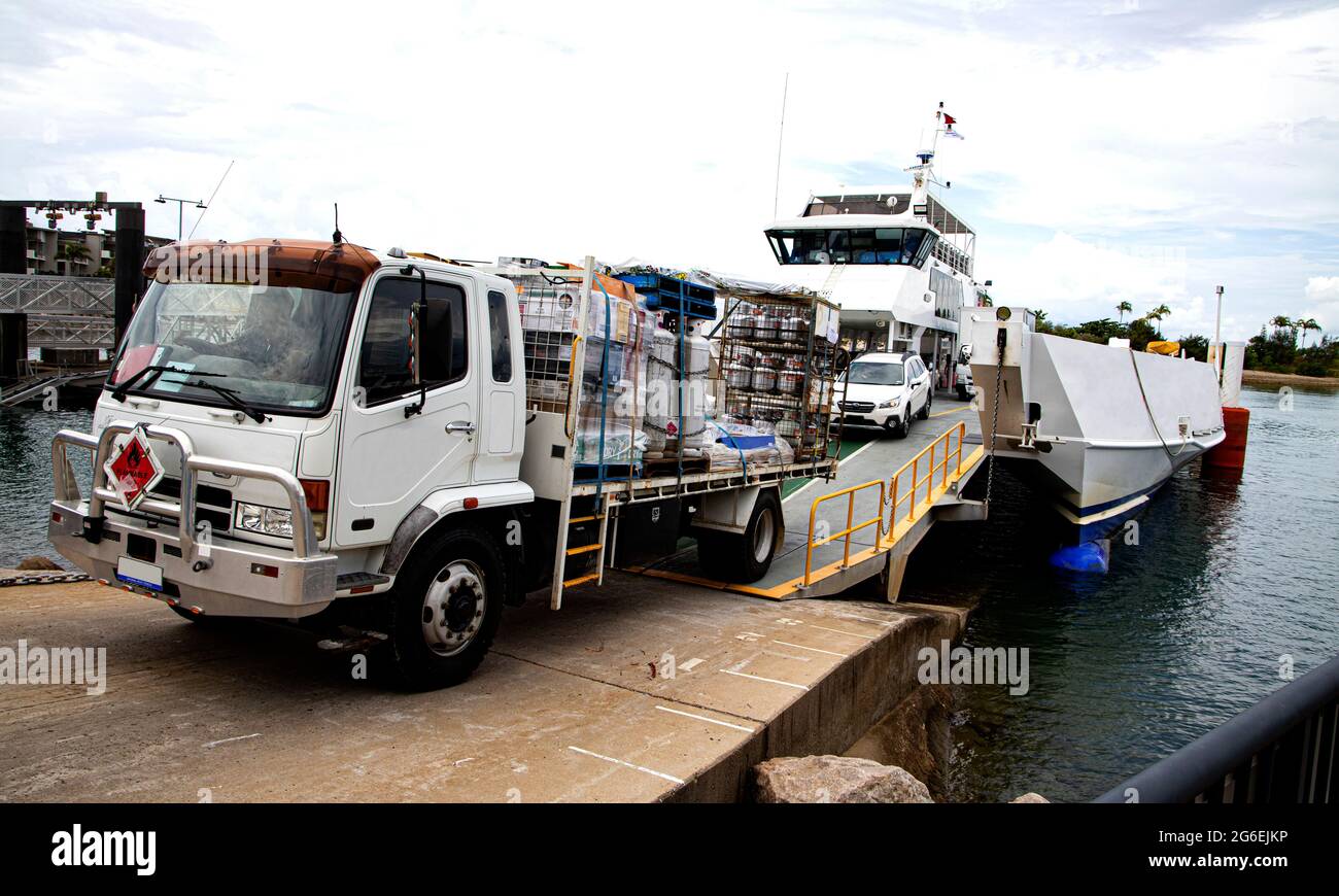 Heavily laden truck with flamable cargo leaving roll on Roll off vehicle ferry at Arcadia on Magnetic Island in north Queensland Australia Stock Photo