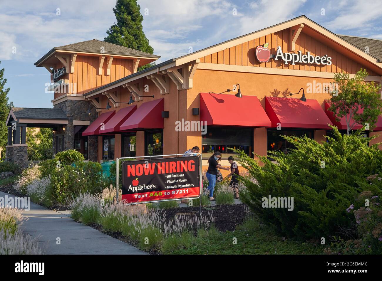 Applebee's restaurant in Windsor, California. NOW HIRING sign posted in