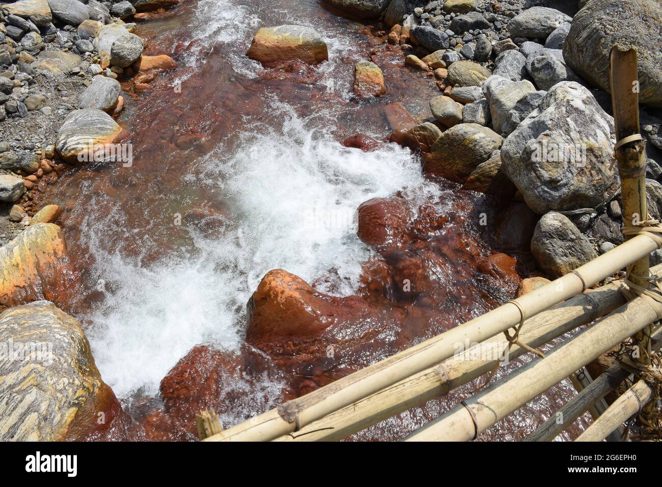 Ariel view Bamboo bridge over high current himalyan river ,the only link in remote village ,Todey , Kalimpong . Stock Photo