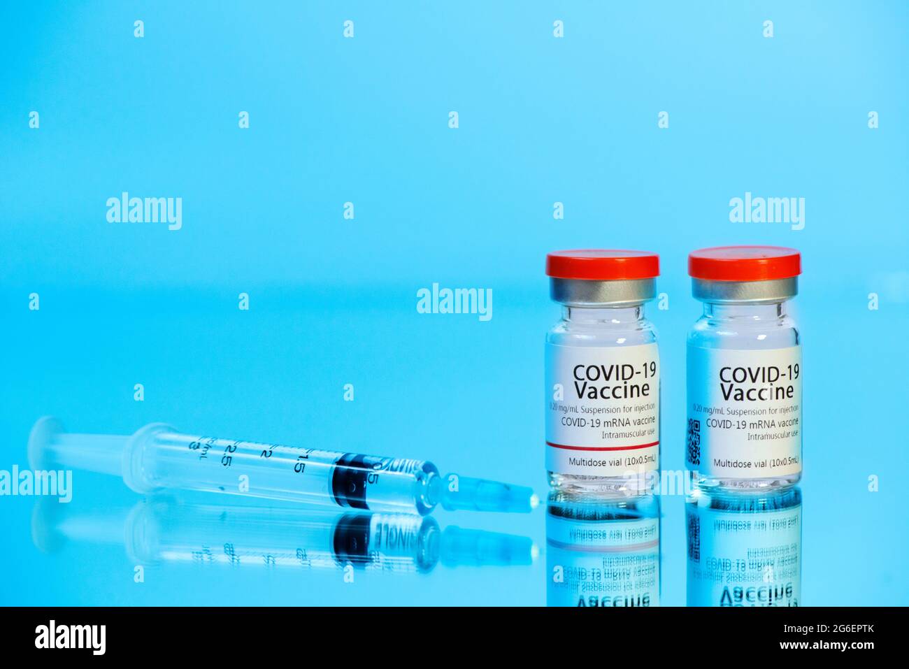 Ampoules with COVID-19 coronavirus vaccine, with a syringe for vaccination. Healthcare And Medical concept. Stock Photo
