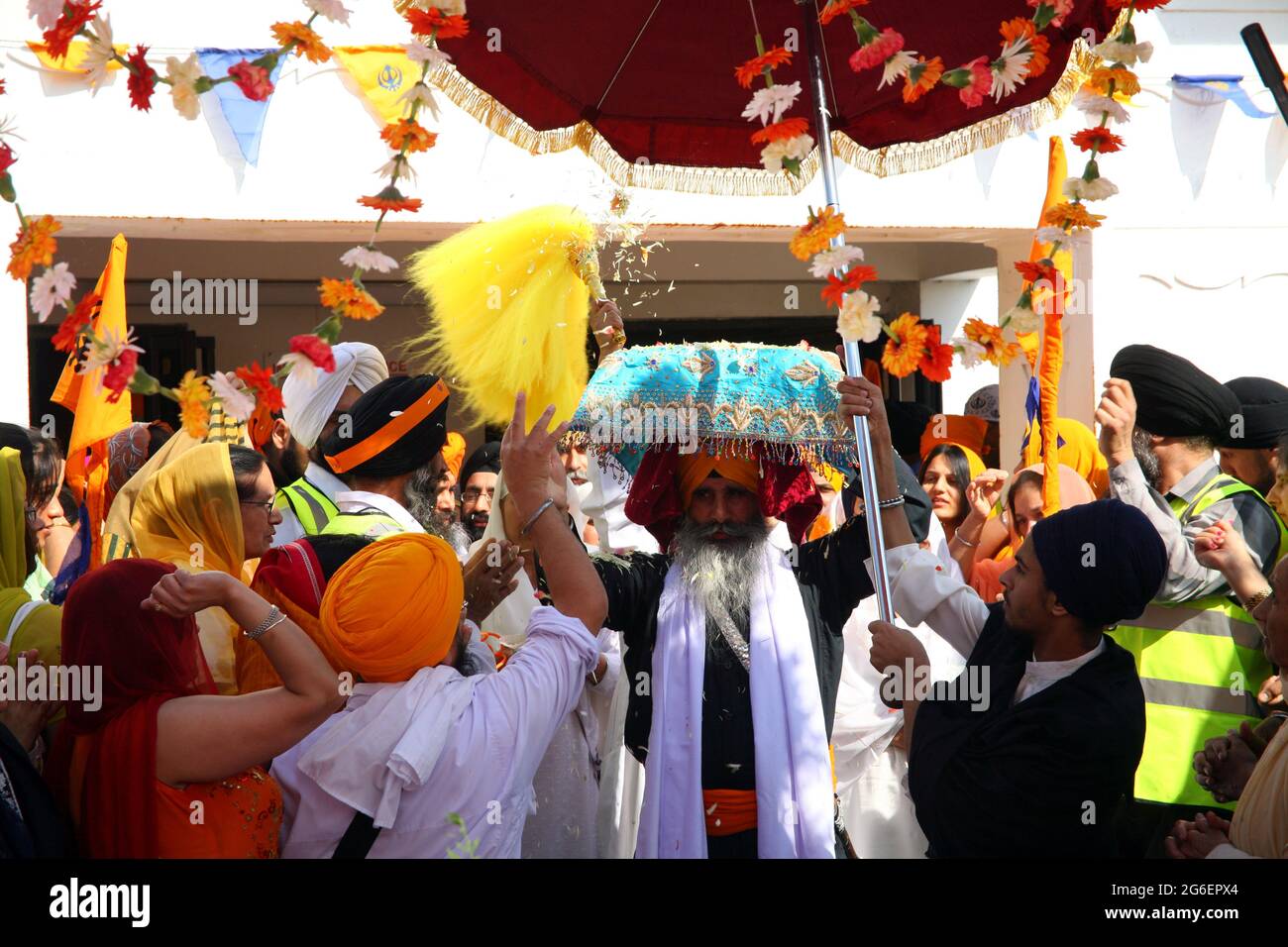 Guru Granth Sahib being carried from the Gurdwara to be transported
