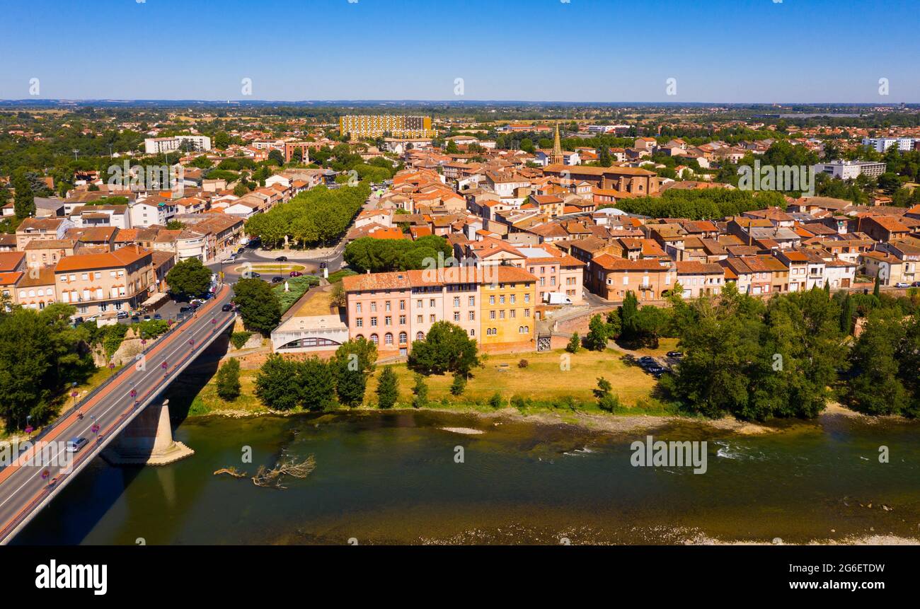 Flight over the city Muret and Garonne river on summer day Stock Photo
