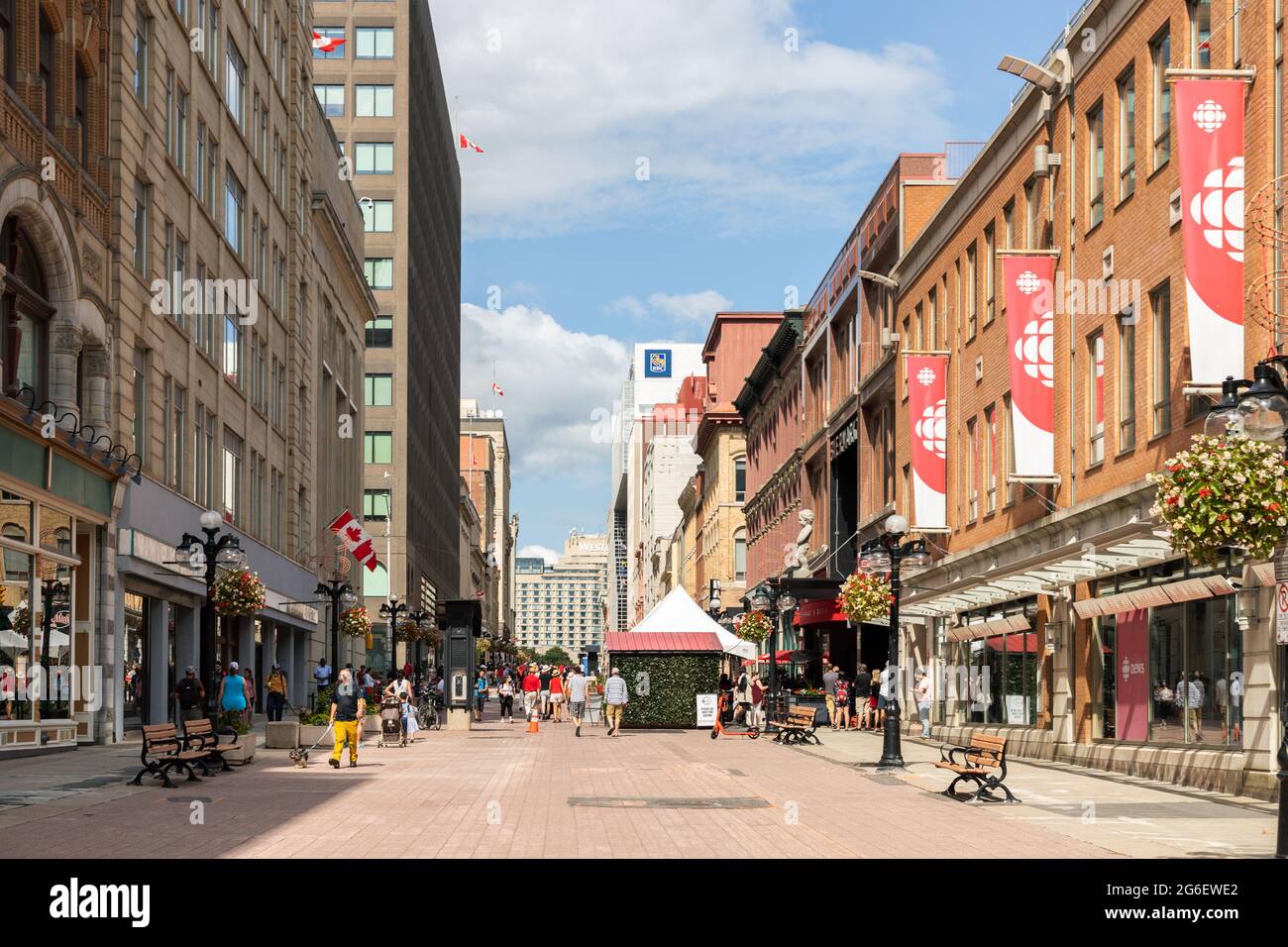 Ottawa, Canada - July 1, 2021: Cityscape street view with walking people in downtown of Ottawa. Sparks street during Canada day holiday. Stock Photo