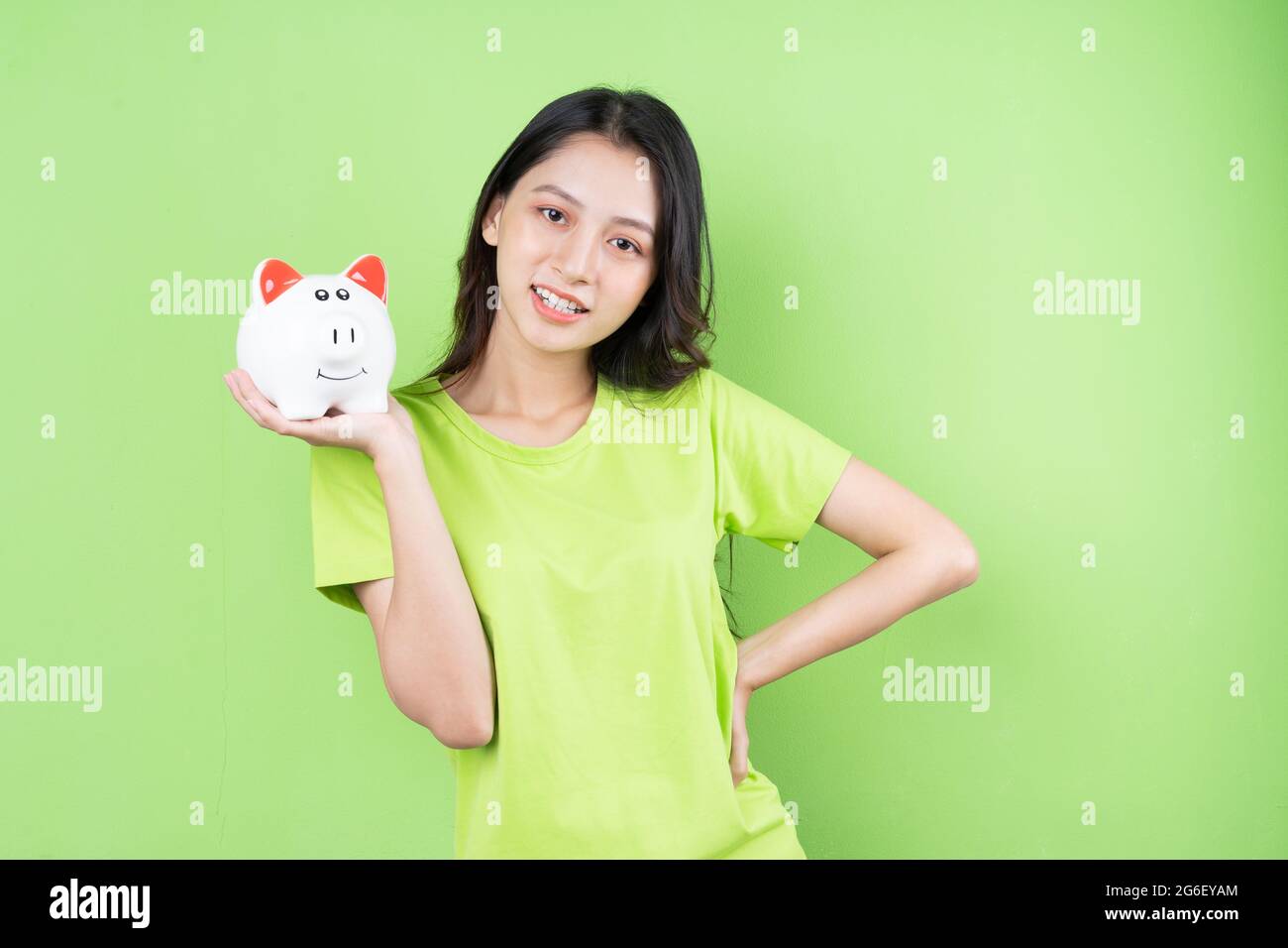 asian girl holding piggy bank in her hand money saving concept Stock ...